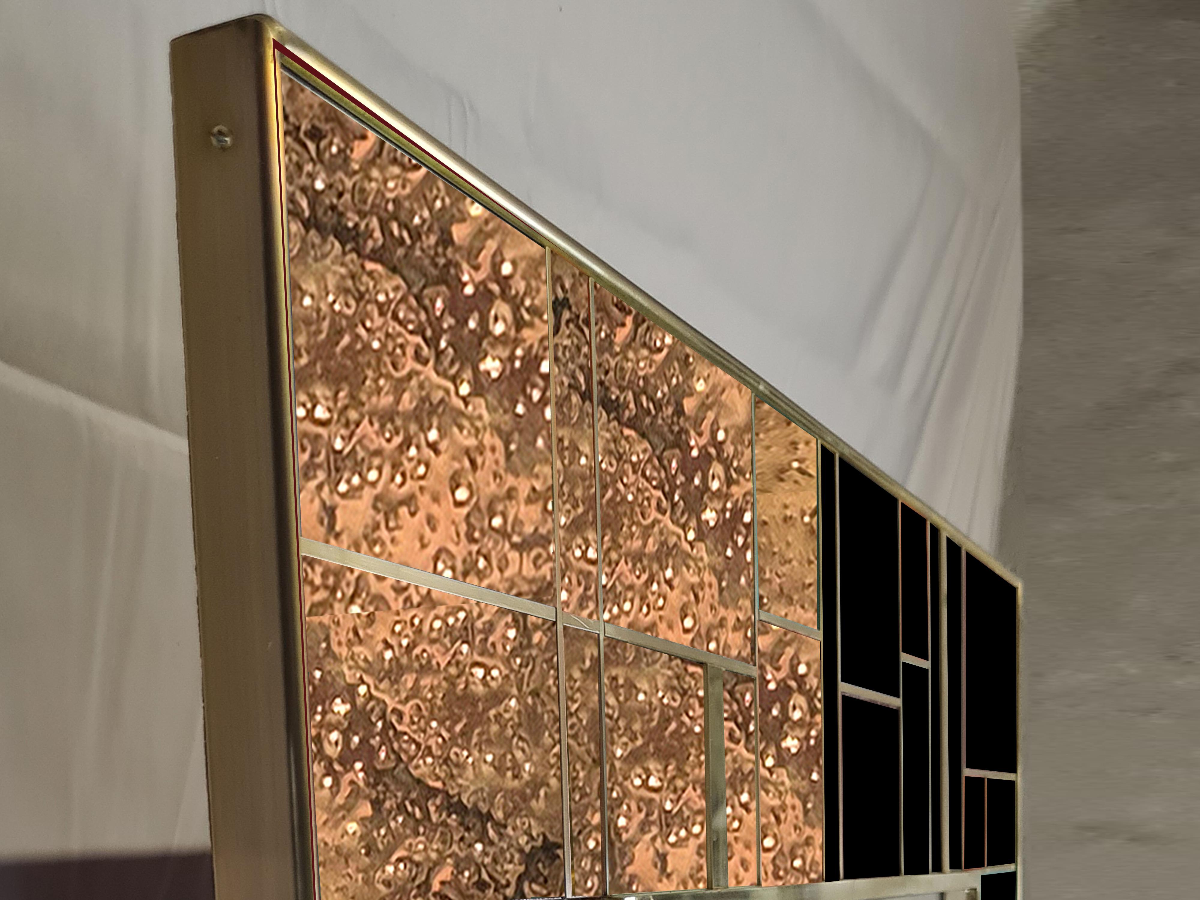 This spectacular rectangular wall mirror in gold-colored brass and black Murano glass is a stunning addition to any space in the home.

Made in Italy, it features a solid birch wood base with hand-carved and soldered details. Elegant L-shaped dotted