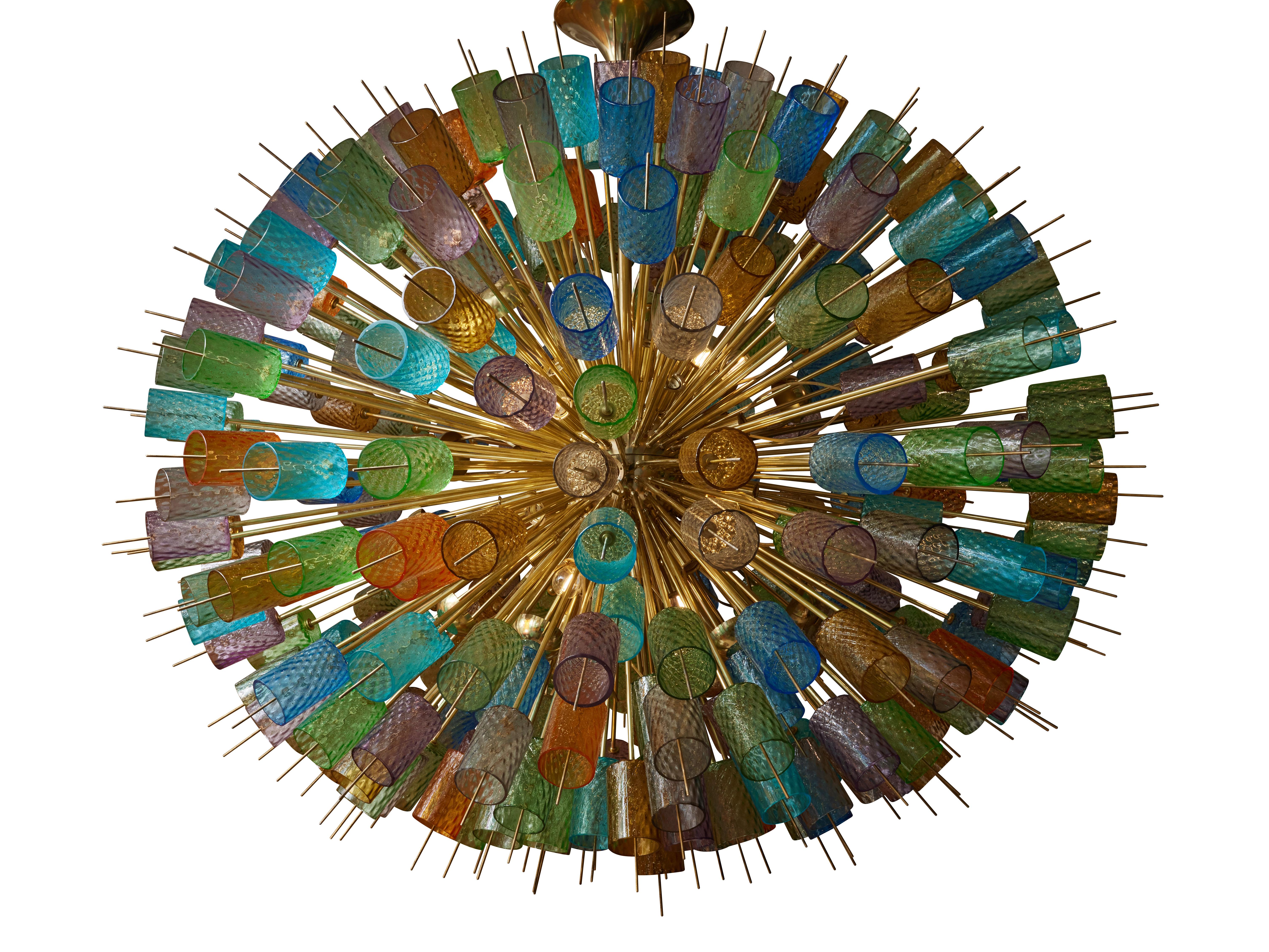 Exceptional sputnik chandelier in brass with colored Murano glasses.
Creation by Studio Glustin.
Italy, 2023.