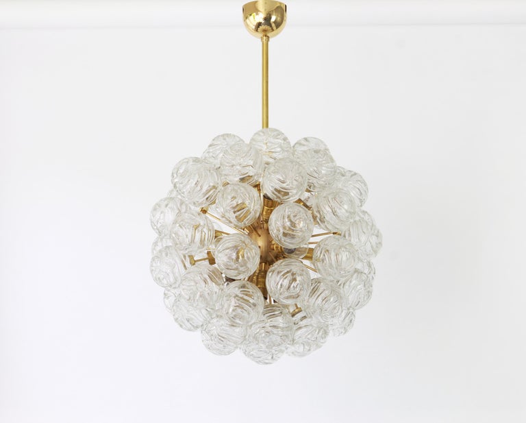 Rare spectacular Sputnik flushmount with glass snowballs designed by Doria, Germany, 1970s.
Stunning shape and great light effect.
All glass balls are in good condition.
It needs 16 small size bulbs (E-14 bulbs) up to 40 watts each.
Light bulbs