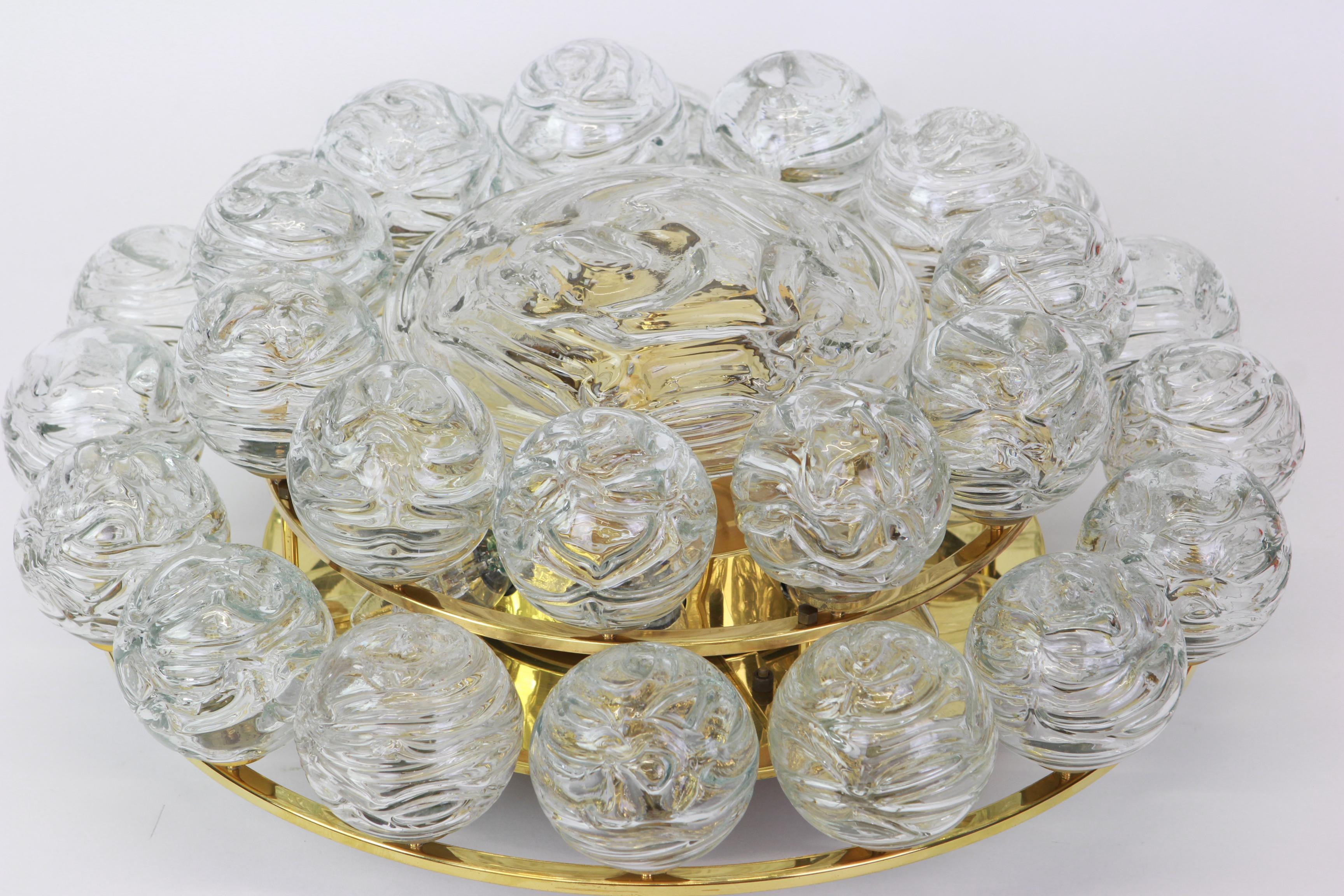 Spectacular Sputnik flush mount with glass snowballs designed by Doria, Germany, 1970s
All glass balls are in very good condition.

Heavy quality and in very good condition. Cleaned, well-wired and ready to use. 
It requires 8 x E14 small bulbs