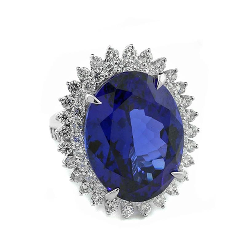 Oval Cut Spectacular Tanzanite 28.28 carat Quality AAA and Diamond 2.69 ct Ring Platinum For Sale