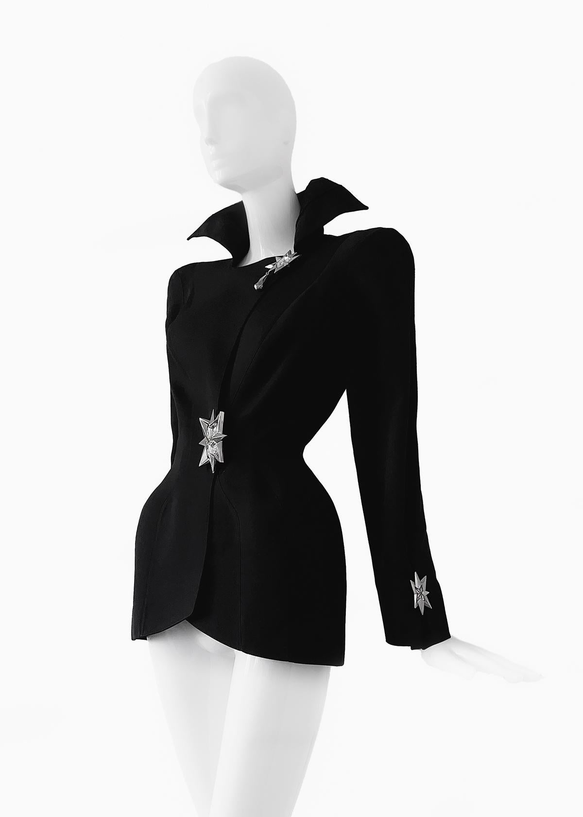 
ICONIC extremely rare Thierry Mugler piece

Museum worthy collectors piece
Fabulous Thierry Mugler jacket with breathtaking crystal jewel details. Assuming FW 1992 collection.
Dramatic Showstopper piece!
Black worsted wool blazer with icnoic