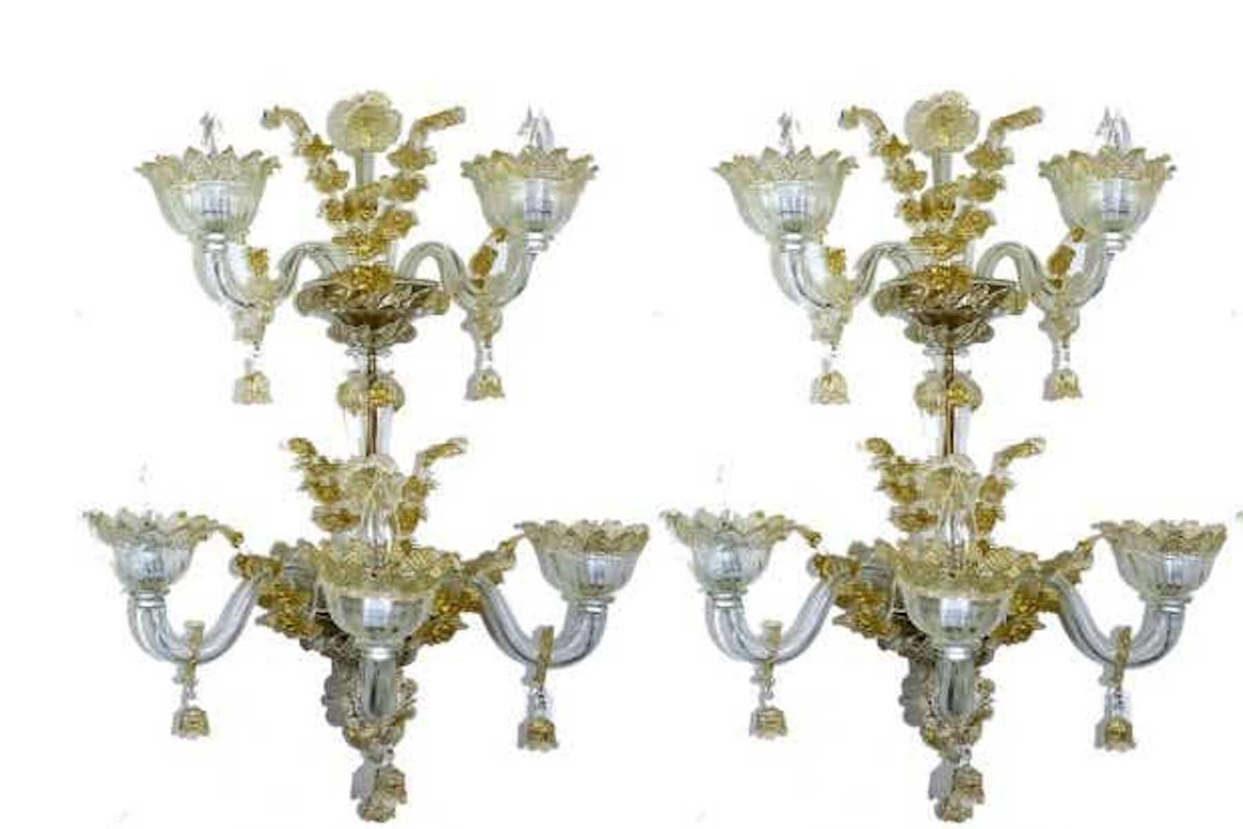 A pair of Venetian Italian gold infused Murano glass sconces, three pair available
Attributed to the Salviati glass works
Each one of large scale two-tier design, of clear and gold infused floral Murano glass, fitted with five-lights each, A rare