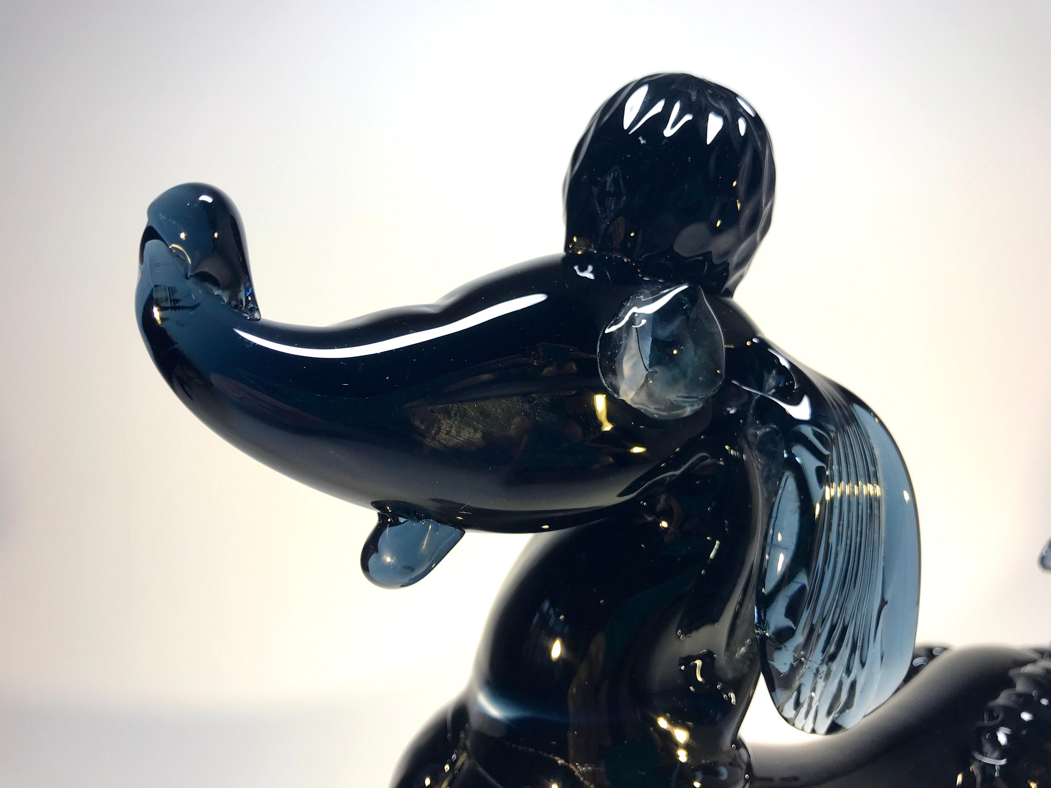 A fabulous and stunning French Poodle figure from Murano glass - oozing Parisian chic!
The color is Midnight blue, almost black- with a hint of indigo
This piece has massive presence,
circa 1960s
Substantial and weighty
Measures: Height 8.25