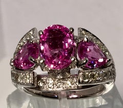 Spectacular Vivid Pink Sapphire Diamond Platinum Three-Stone Ring