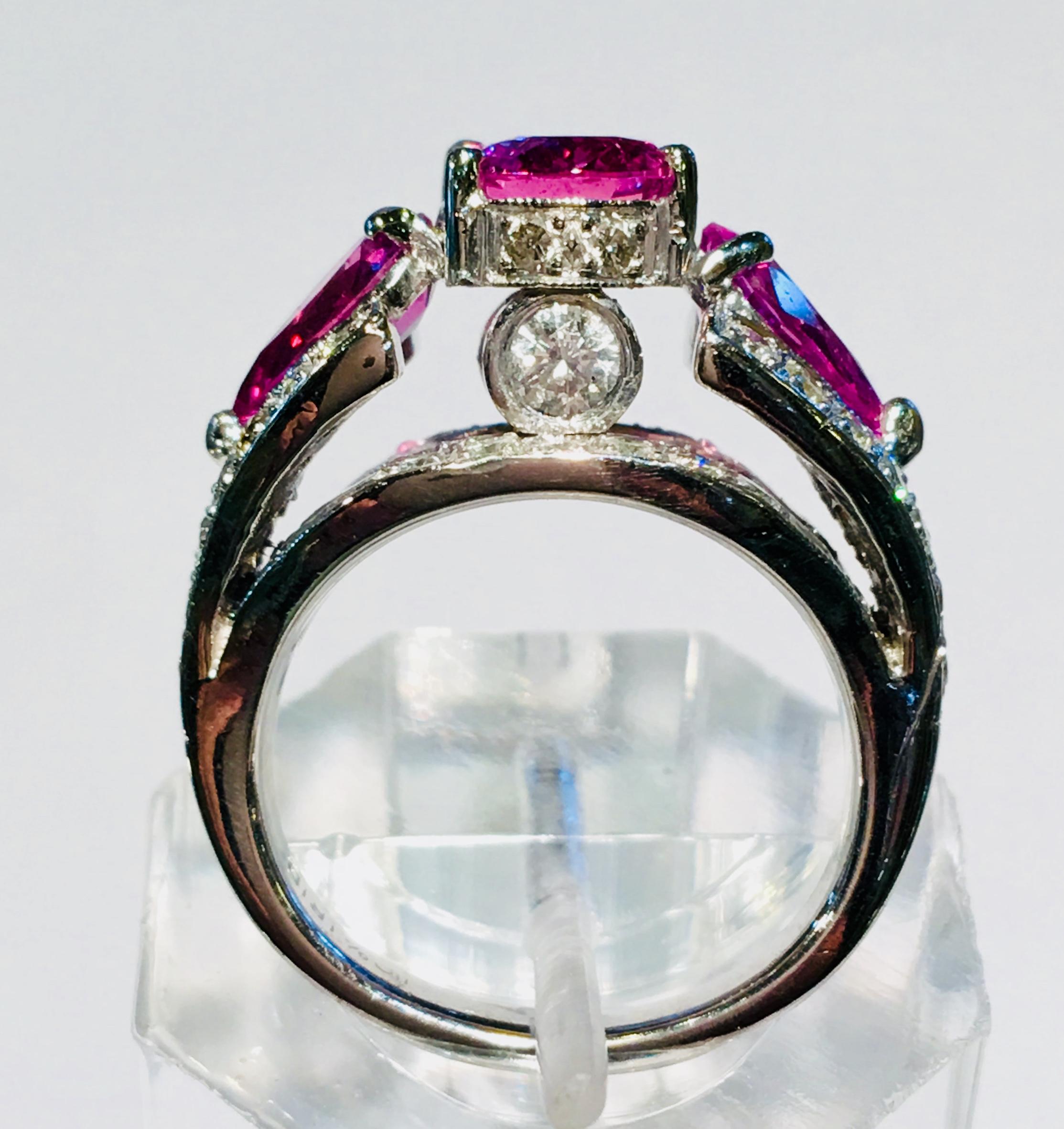 Contemporary Spectacular Vivid Pink Sapphire Diamond Platinum Three-Stone Ring For Sale