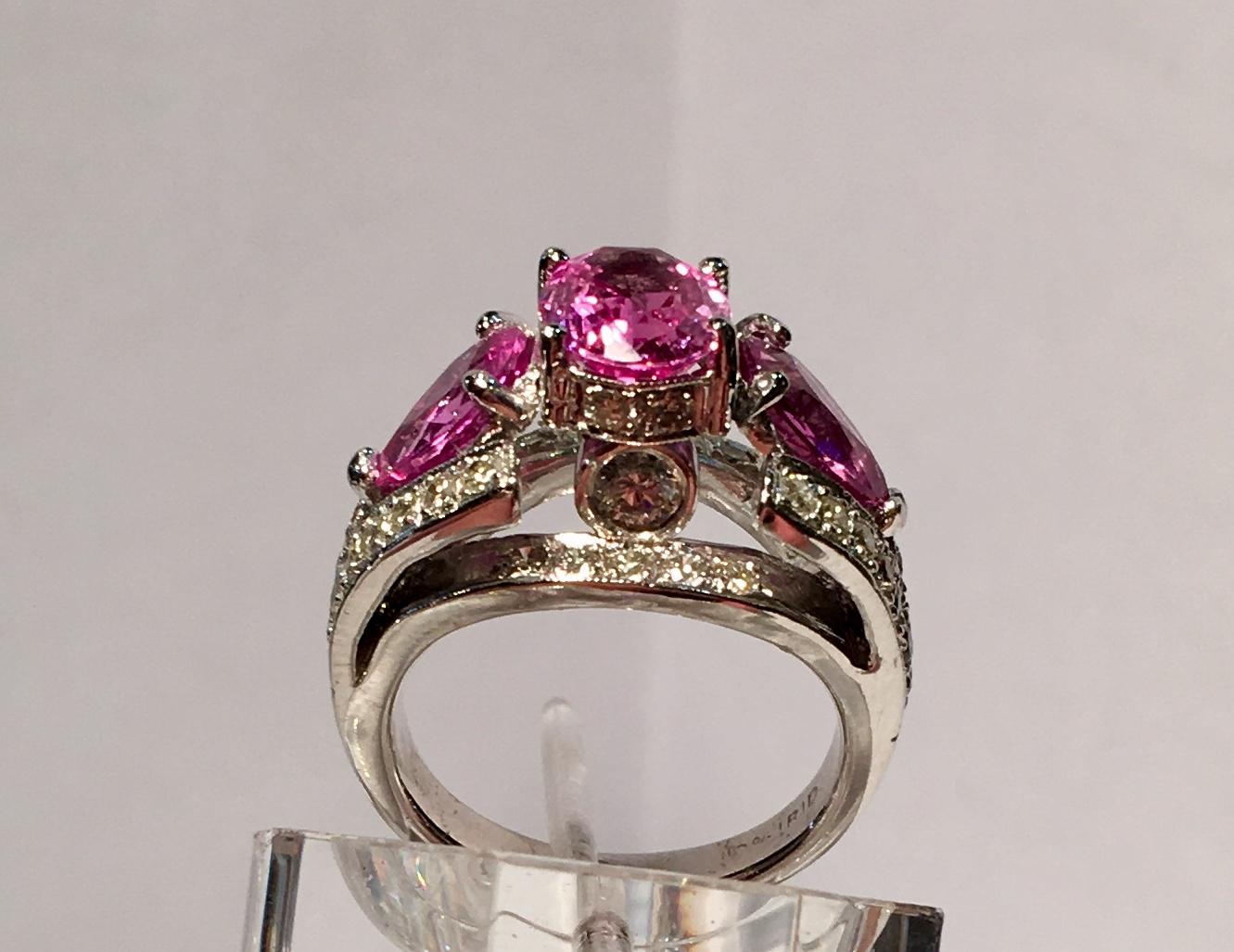 Oval Cut Spectacular Vivid Pink Sapphire Diamond Platinum Three-Stone Ring For Sale