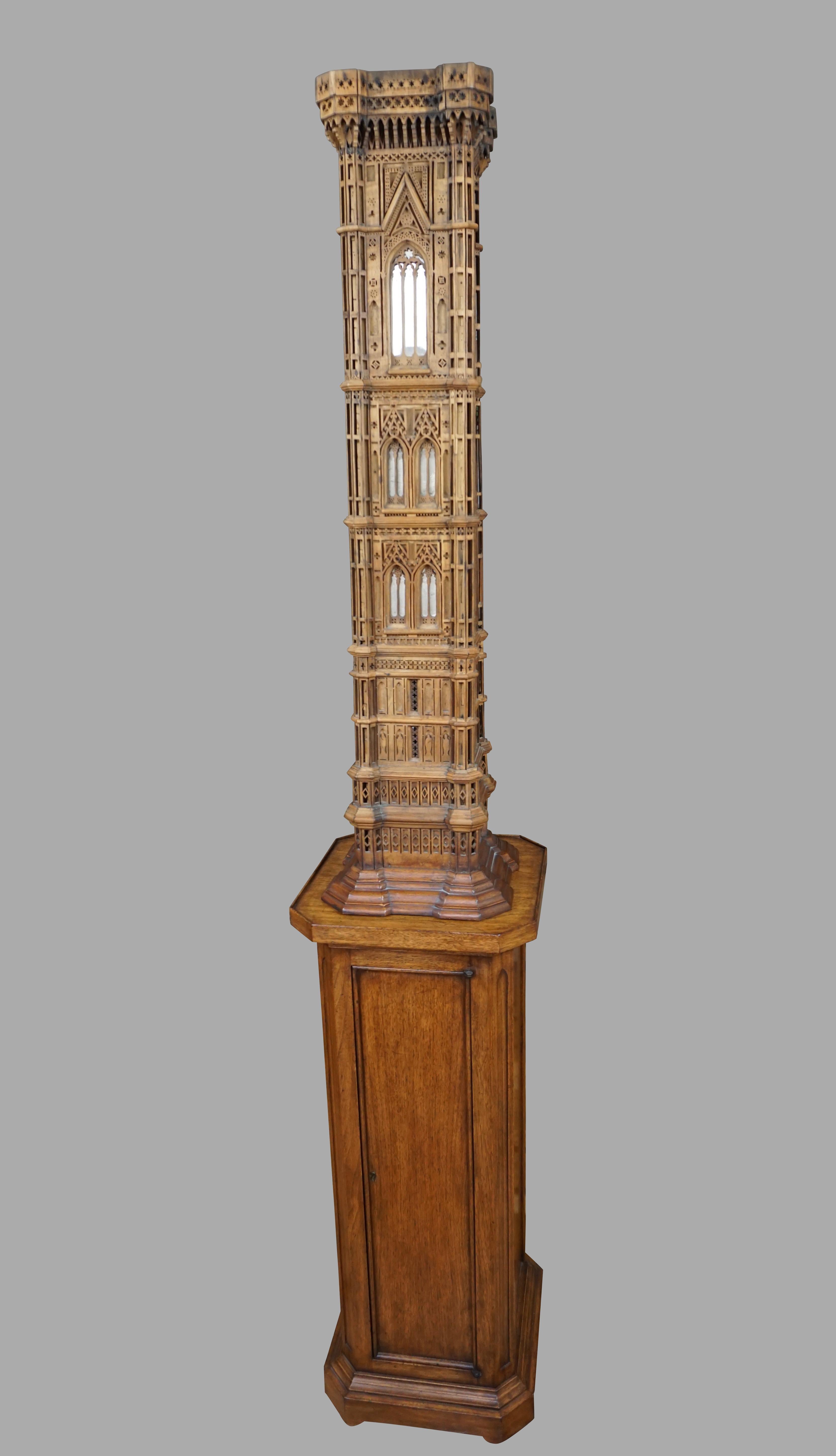 A spectacular and finely executed Marquette of Giotto's famous campanile in Florence, Italy. This carved and reticulated walnut model of the bell tower has mirrored inserts and remains in very good overall condition. It is a faithful representation