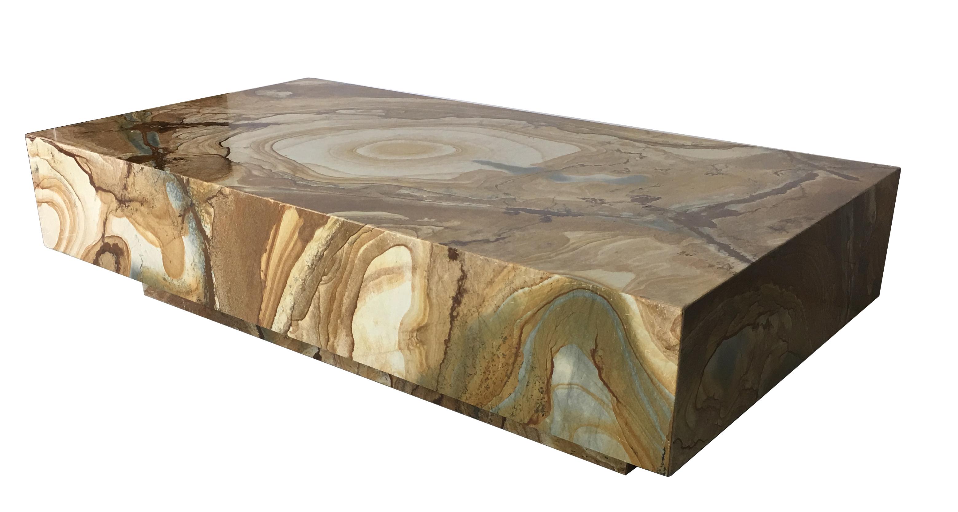 Wildly grained slab form Coffee Table raised on a plinth base.  The  base is recessed, giving the table the virtual look of floating.  The overall height can be adjusted from 12” to 16” with the use of wood shims.