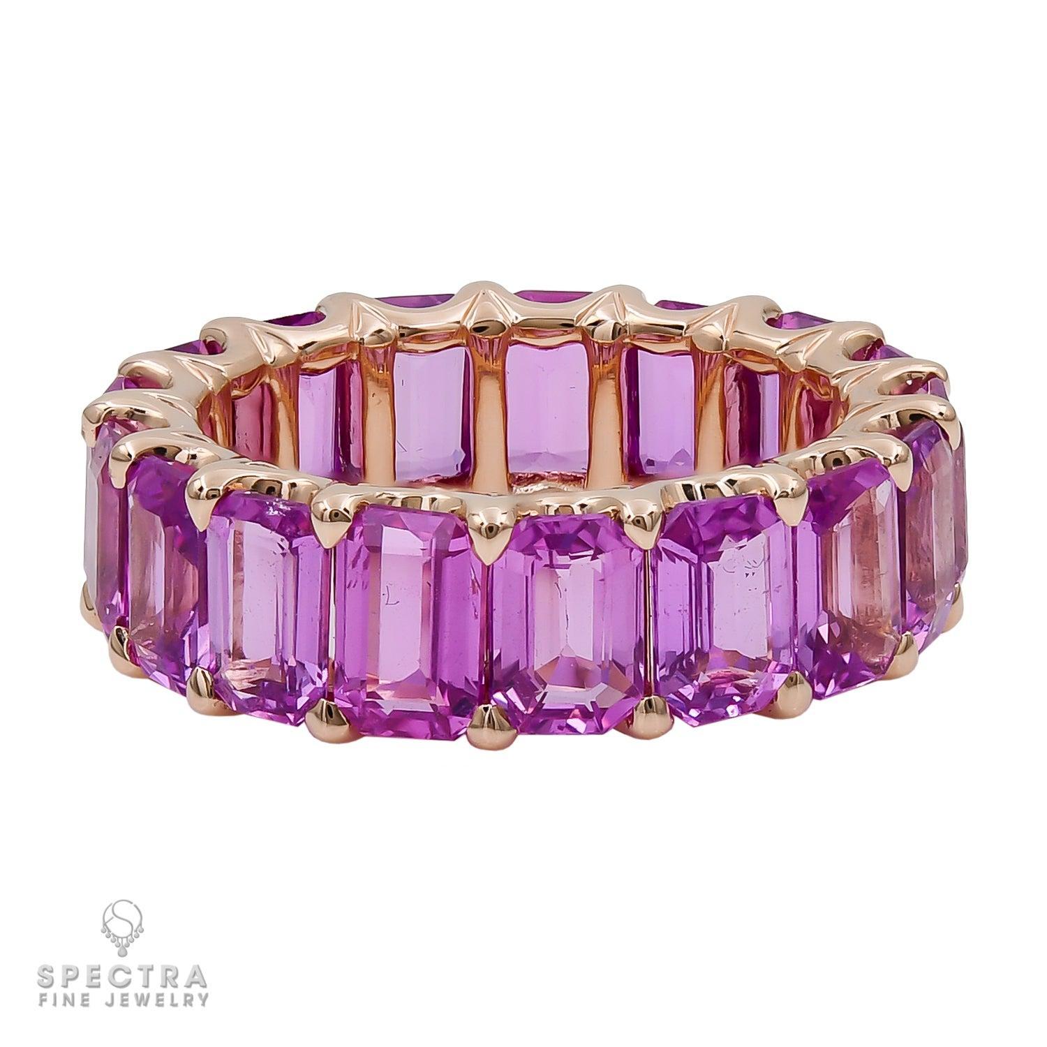 Spectra Fine Jewelry 10.43 Carat Pink Sapphire Eternity Band Ring.
A fancy eternity ring comprising of 17 emerald-cut pink sapphires weighing a total of 10.43 carats. 
Average weight of each stone is 0.61 carat. 
The sapphires are all natural, not