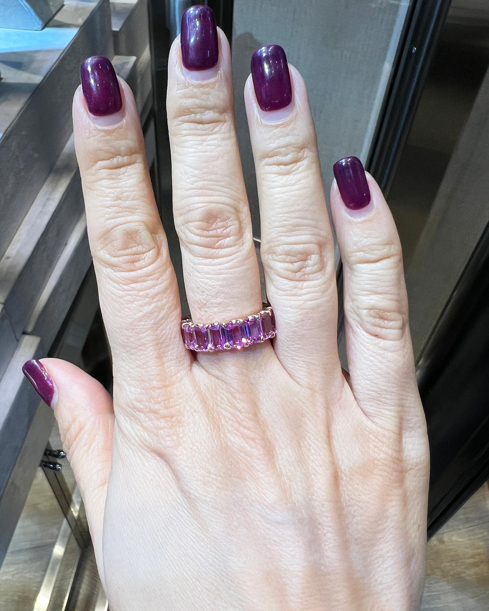 A fancy eternity ring comprising of 17 emerald-cut pink sapphires weighing a total of 10.43 carats. Average weight of each stone is 0.61 carat. The sapphires are all natural, not certified.
18k rose gold, gross weight is 7.13 gram.
Size 6.5. Not
