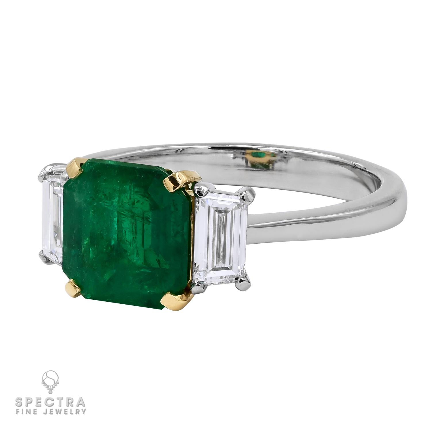 This exquisite ring made by Spectra Fine Jewelry showcases the timeless beauty of a 2.11-carat emerald-cut Colombian emerald, prized for its lush green hue and natural charm, with only minor clarity enhancement to preserve its authenticity.