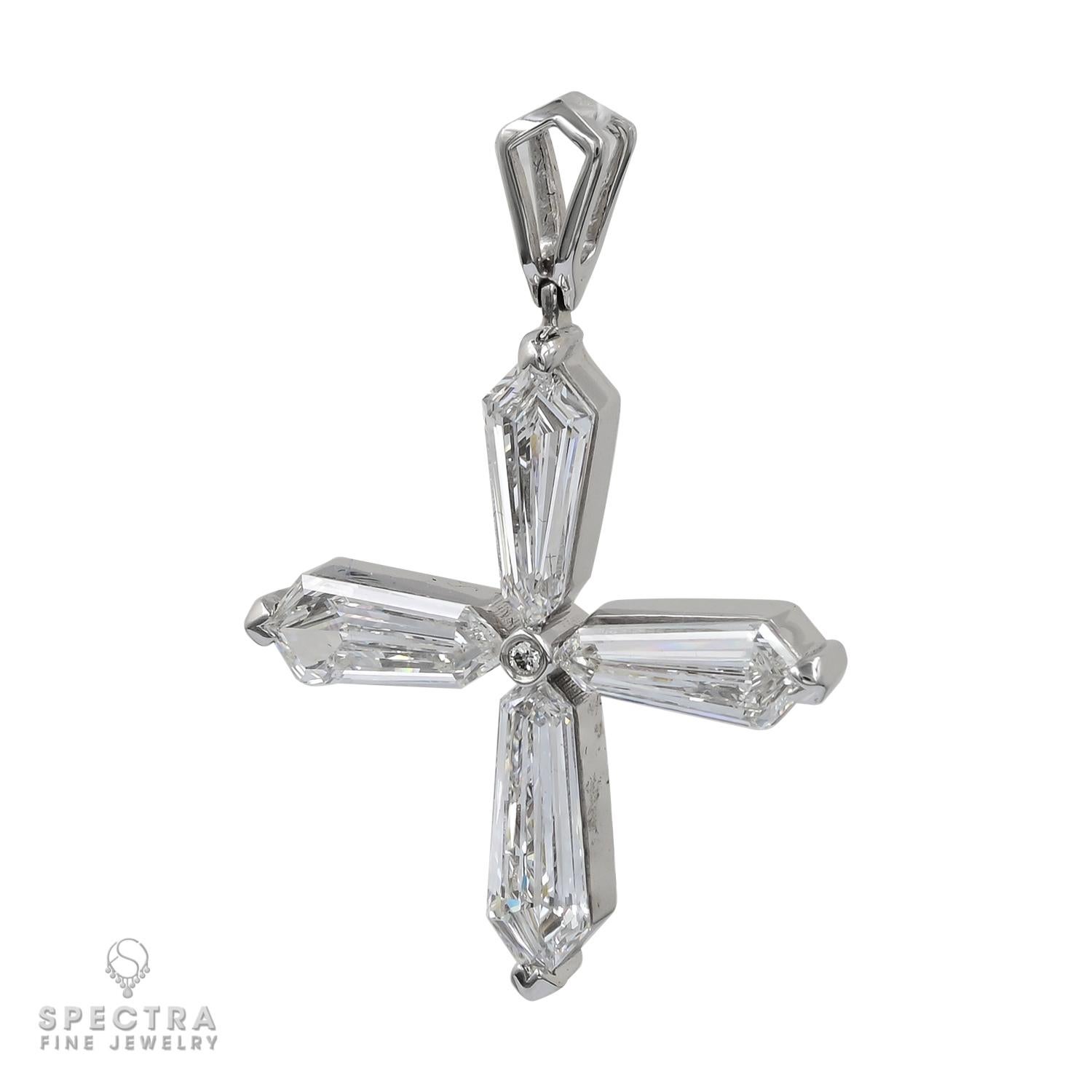 This elegant cross pendant is a striking expression of refined beauty, crafted in luminous 18k white gold. Its unique design features four all-natural kite-shaped diamonds, totaling 3.39 carats, arranged in perfect harmony to capture the light from