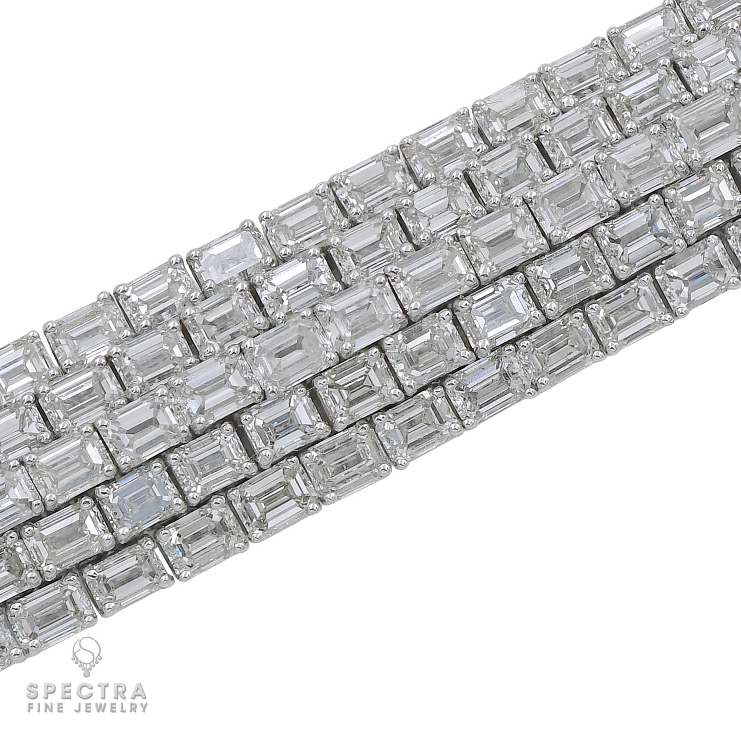 A classy bracelet comprising of 5 rows of emerald-cut diamonds set in 18k white gold.
215 diamonds weighing a total of 40.40 carats, with E-F-G color, VS clarity.
Each diamond is 0.19 carat.
All diamonds are natural, not certified. Appraisal
