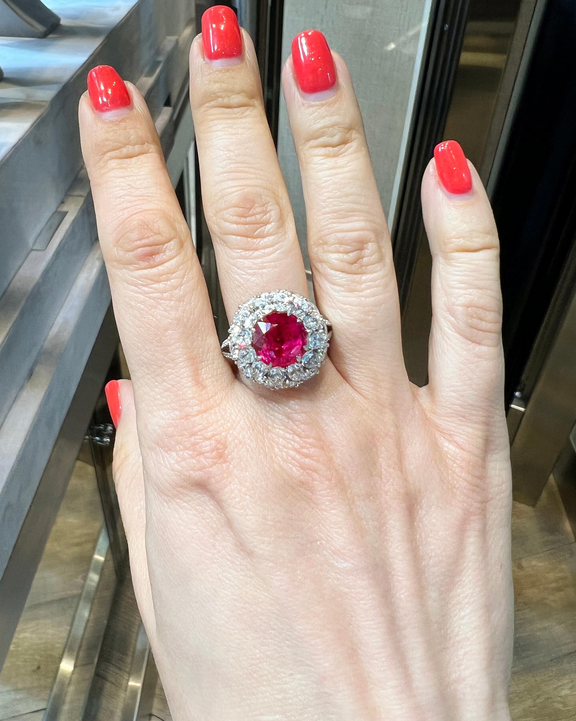 A beautiful cocktail ring featuring a 4.99 cushion ruby accented with diamonds.
The ruby is not certified.
Diamond weights:
12 pear shape diamonds = 2.17 carats.
12 round diamonds = 2.50 carats.
68 pave diamonds = 0.29 carats.
Total weight of