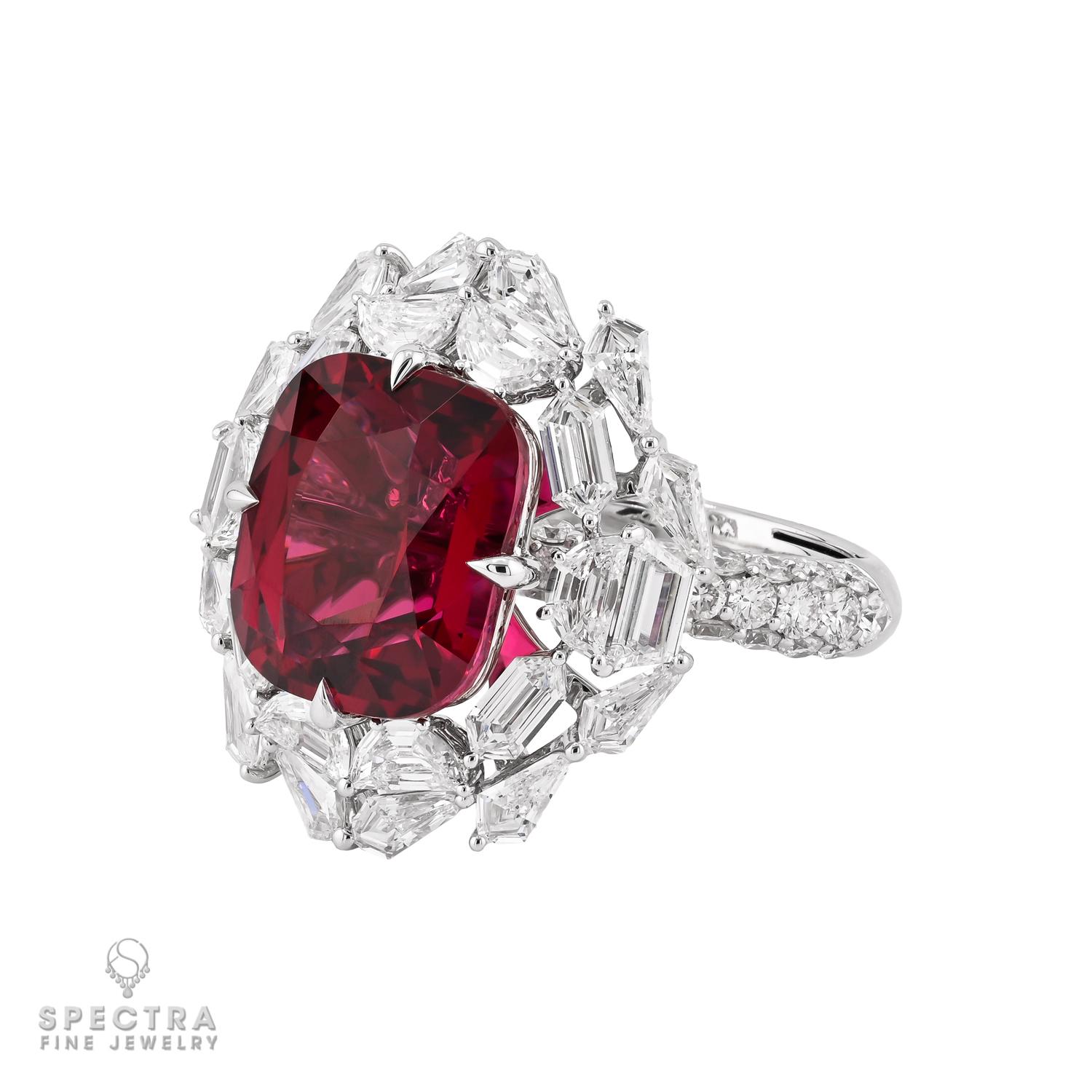 A striking display of elegance and rarity, this exquisite cocktail ring showcases a mesmerizing 8.88-carat cushion-cut red spinel with a captivating depth of color. Sourced from Tanzania and certified by AGL, the spinel’s rich crimson hue radiates