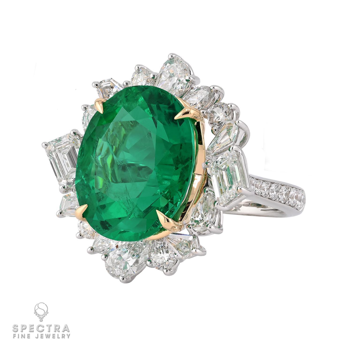 This spectacular 11.32-carat Colombian Emerald Diamond Ring is set in 18k white gold, weighing 11.38 grams. The center stone, a stunning oval Colombian emerald with minor enhancement, is certified by AGL for authenticity. Surrounding the emerald are