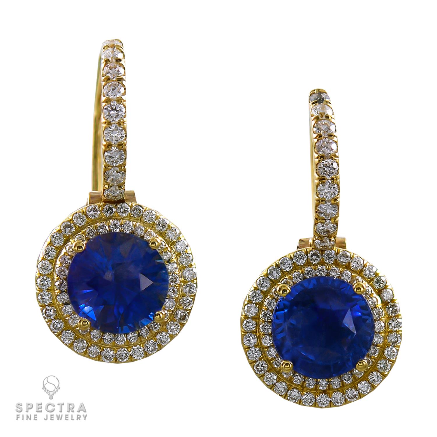 A pair of earrings showcasing two round sapphires weighing 1.78 and 1.94 carats each, set in a double halo of pave diamonds weighing a total of 0.9 carats.
Metal is 18k yellow gold; gross weight 5.1 g.
A matching ring is available.
Message direct