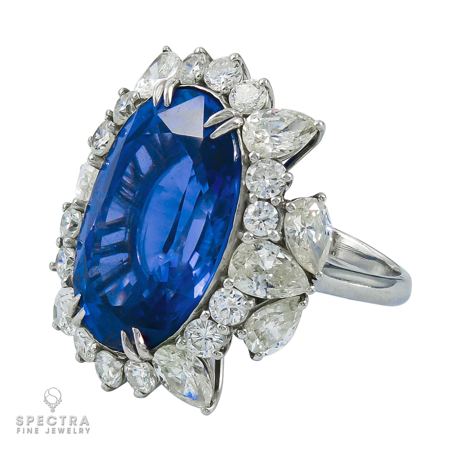 A stunning cocktail ring featuring a 26.19 carat oval blue sapphire and white diamonds.
The sapphire is certified by AGL (American Gemological Laboratories) stating that the stone is of Ceylon origin with no indication of heating or clarity