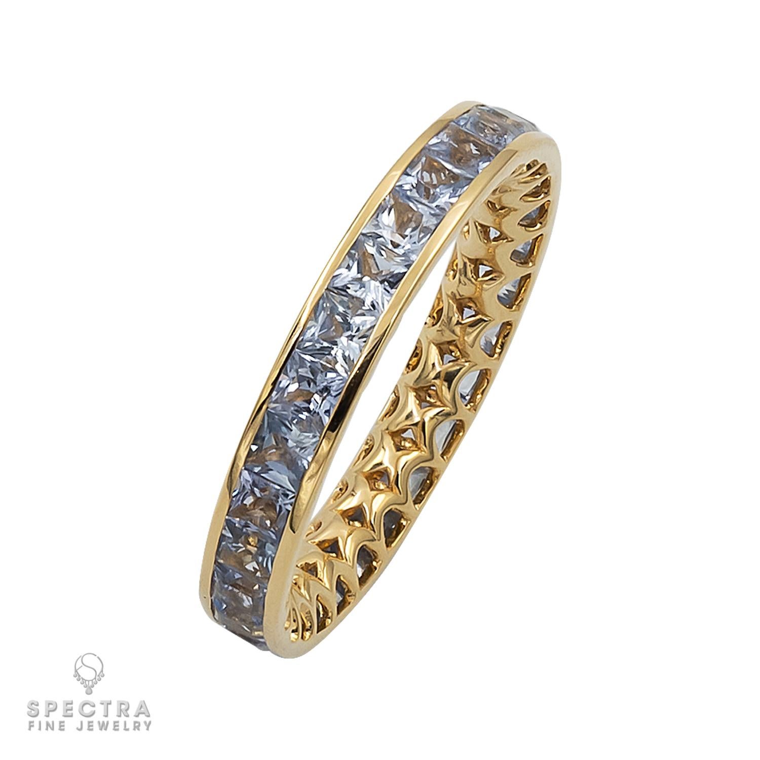2.75-carat Ceylon Heated Blue Sapphire Yellow Gold Eternity Band, a true gem from Spectra Fine Jewelry. Crafted with meticulous artistry, this band features a stunning Ceylon Heated Blue Sapphire, known for its captivating hue. Set in 18k yellow