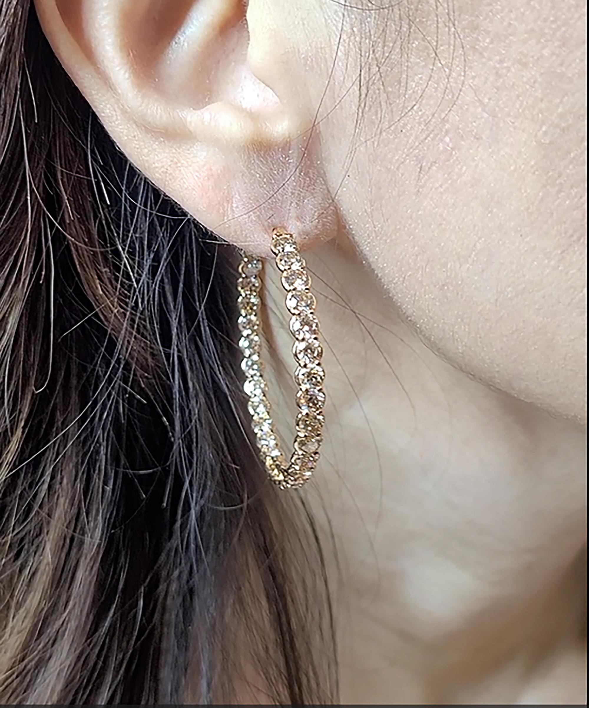 Introducing our stunning desk-to-event Diamond Hoop Earrings, the perfect addition to any jewelry collection. These earrings are crafted from 18k rose gold, giving them a warm and luxurious hue that complements the sparkling diamonds