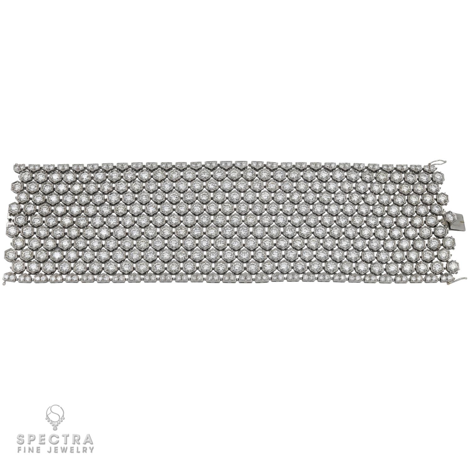 Chic flexible bracelet embellished with diamonds and set in 18K white gold.
72 carats of round diamonds, F-G colors, VS clarity.
The bracelet is 7.25 in long and 2.16 in wide. 
Gross weight 126.51 gr.