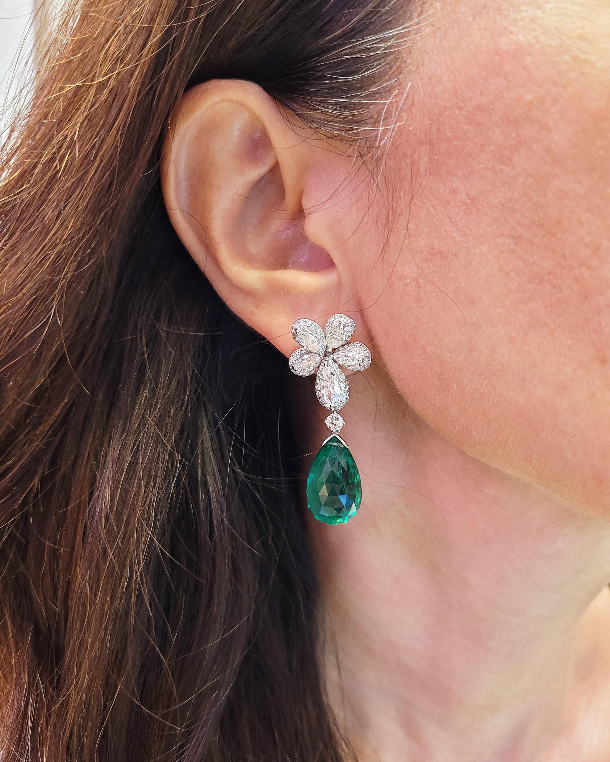 A pair of the beautiful earrings comprising two briolette emeralds, weighing a total of approximately 33.35 carats, with floral tops, set with round and marquise-shaped diamonds, weighing a total of approximately 8.30 carats.
Accompanied by GRS