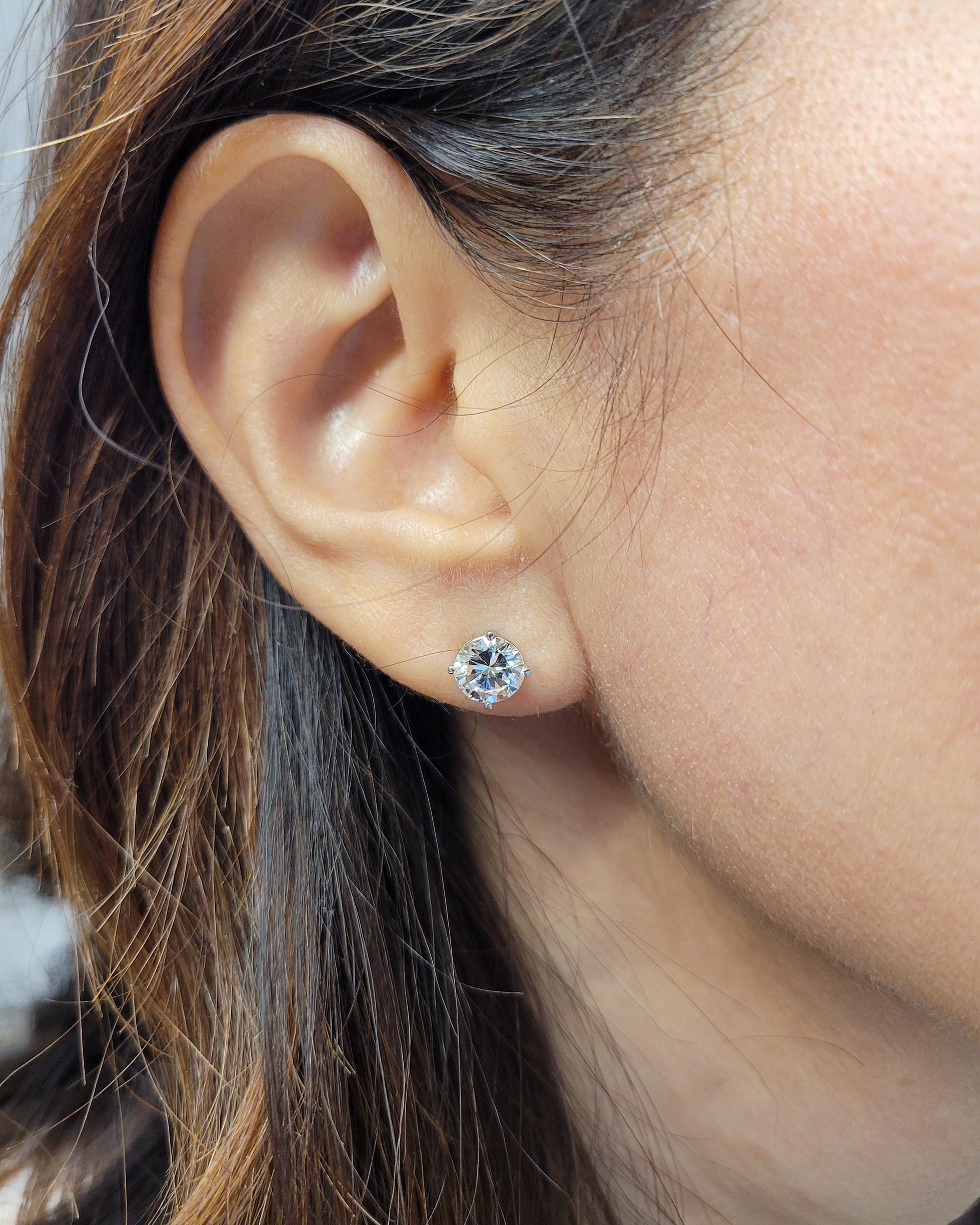 Introducing these stunning diamond stud earrings, featuring round brilliant-cut diamonds of exceptional quality and brilliance. With a combined weight of 2.59 carats, these diamonds have been certified by the prestigious Gemological Institute of