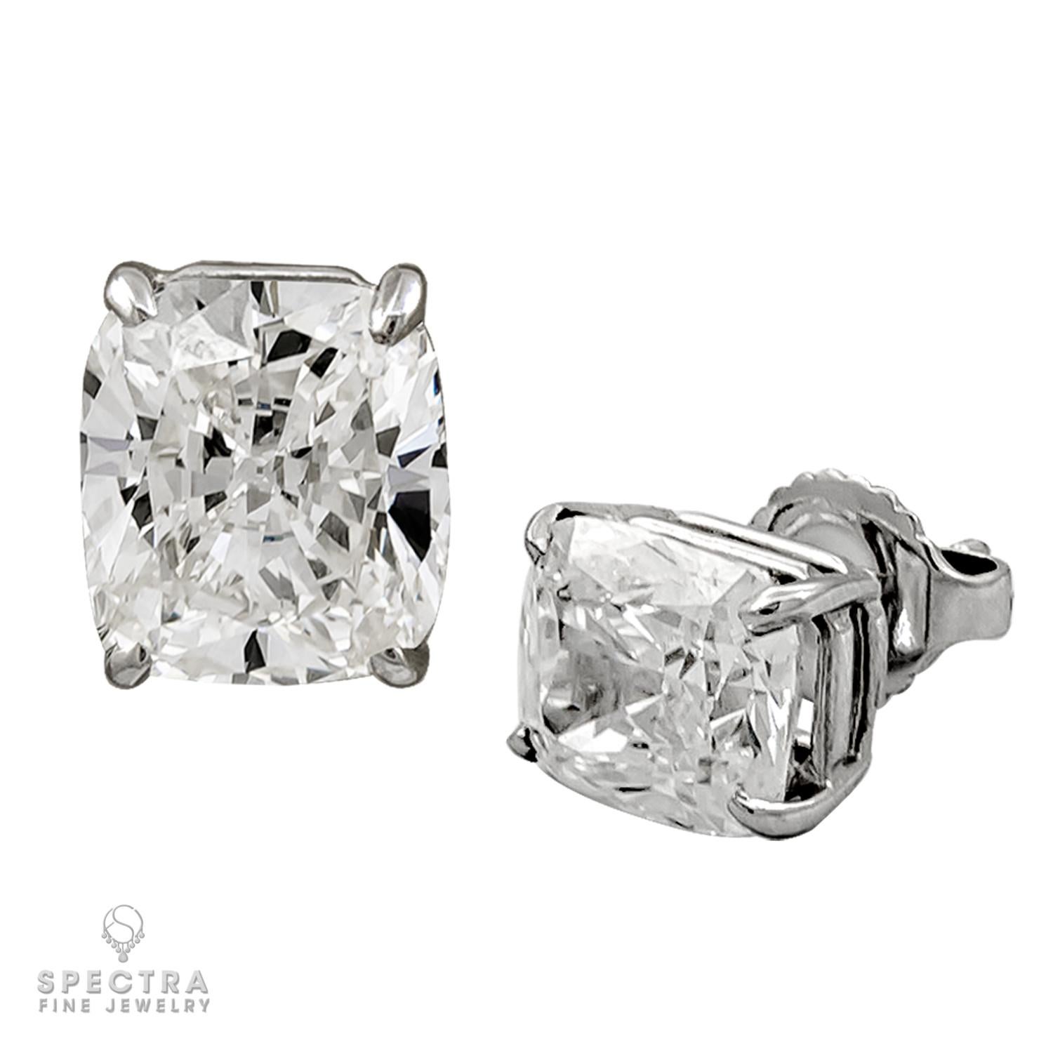 Introducing our stunning pair of stud earrings, featuring two dazzling cushion-shaped diamonds that are sure to catch the eye. With a weight of 2.04 carats and 2.07 carats respectively, these G color, VS1 clarity diamonds have been certified by the