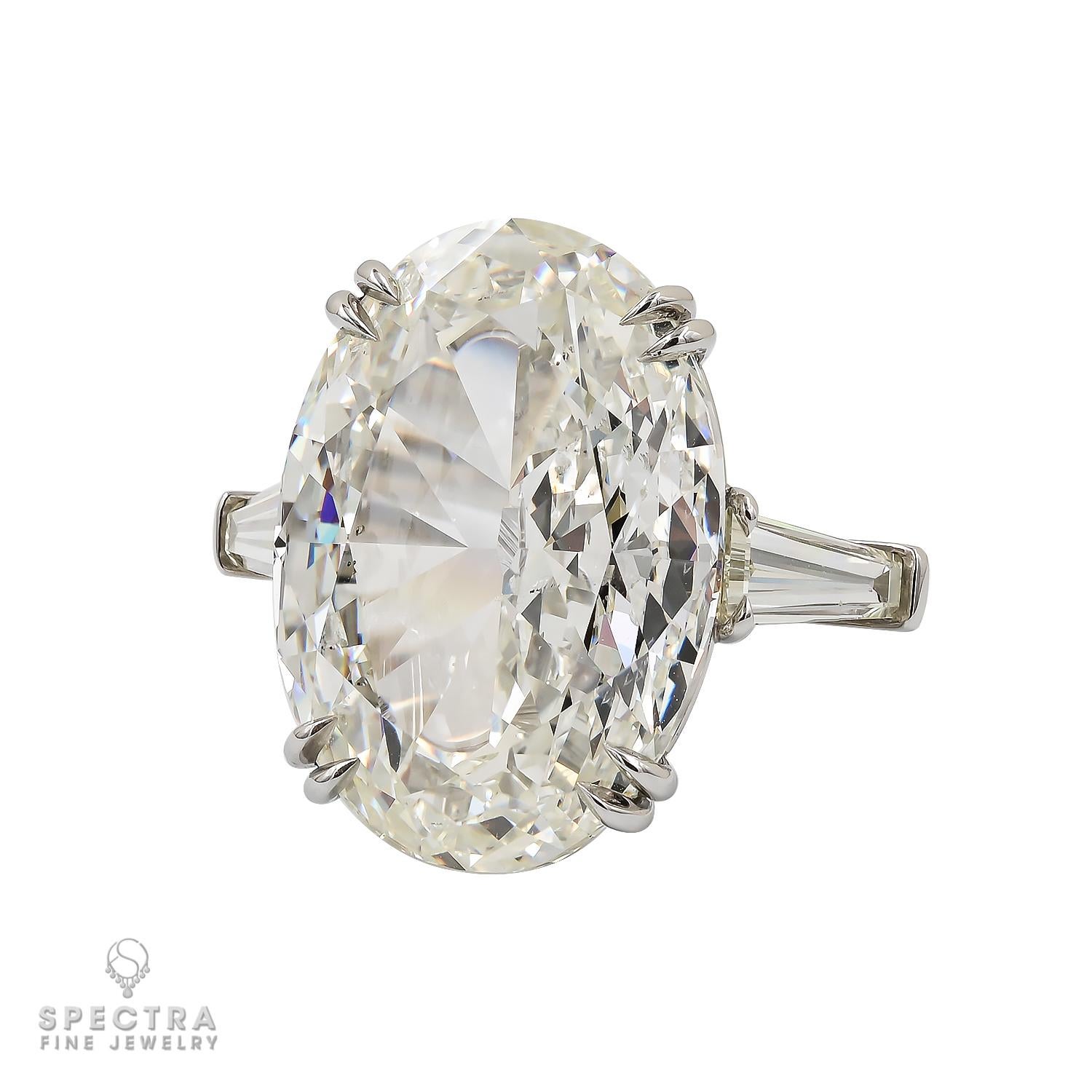 This exquisite engagement ring made by Spectra Fine Jewelry features a dazzling 20.07ct oval-cut diamond at its center, certified by the Gemological Institute of America (GIA) with a color grade of L and a clarity grade of SI2.

The centerpiece is