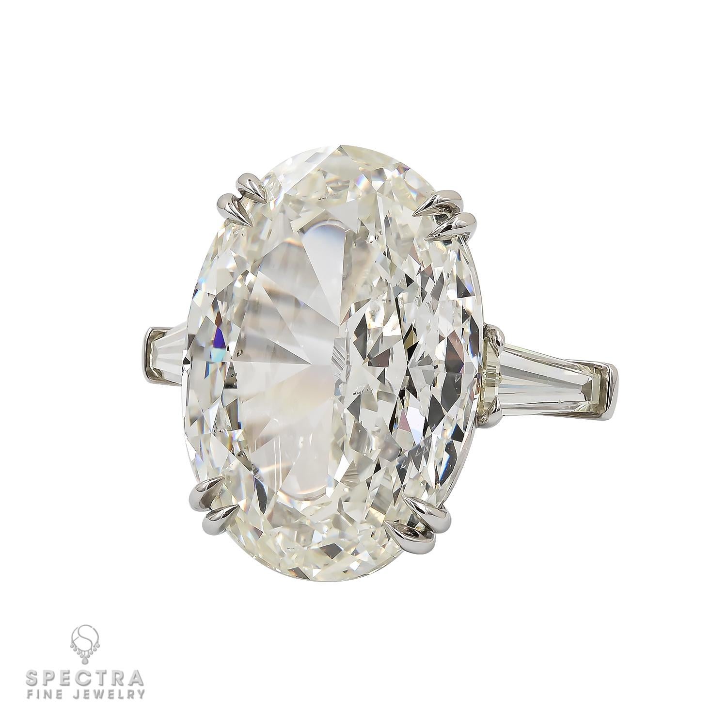 This exquisite engagement ring made by Spectra Fine Jewelry features a dazzling 20.07ct oval-cut diamond at its center, certified by the Gemological Institute of America (GIA) with a color grade of L and a clarity grade of SI2.

The centerpiece is