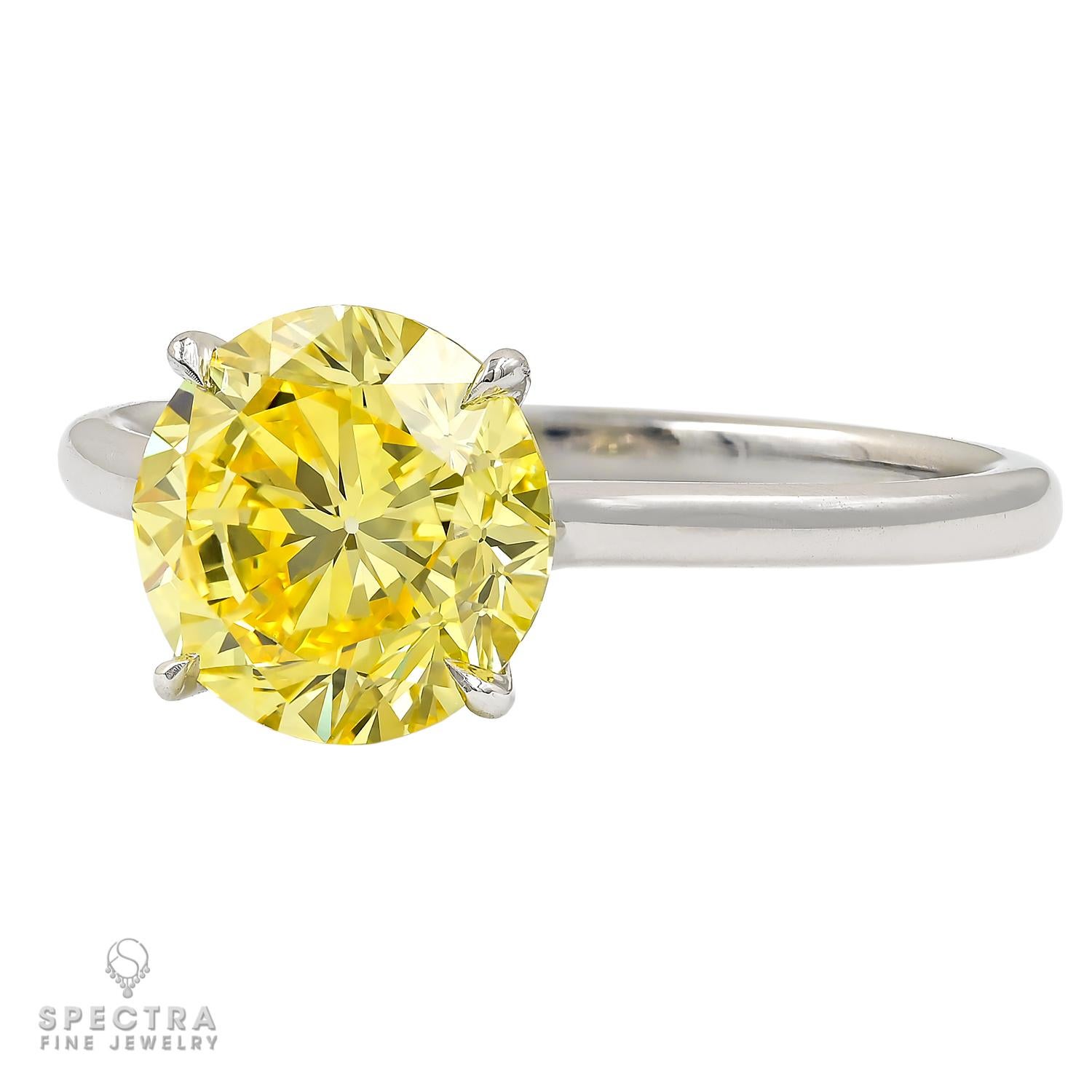 This remarkable piece boasts a 2.37 carat Round Yellow Diamond, an absolute marvel in the world of fine jewelry. Certified by the Gemological Institute of America (GIA) as Fancy Vivid Yellow and Internally Flawless, the diamond is a true rarity,