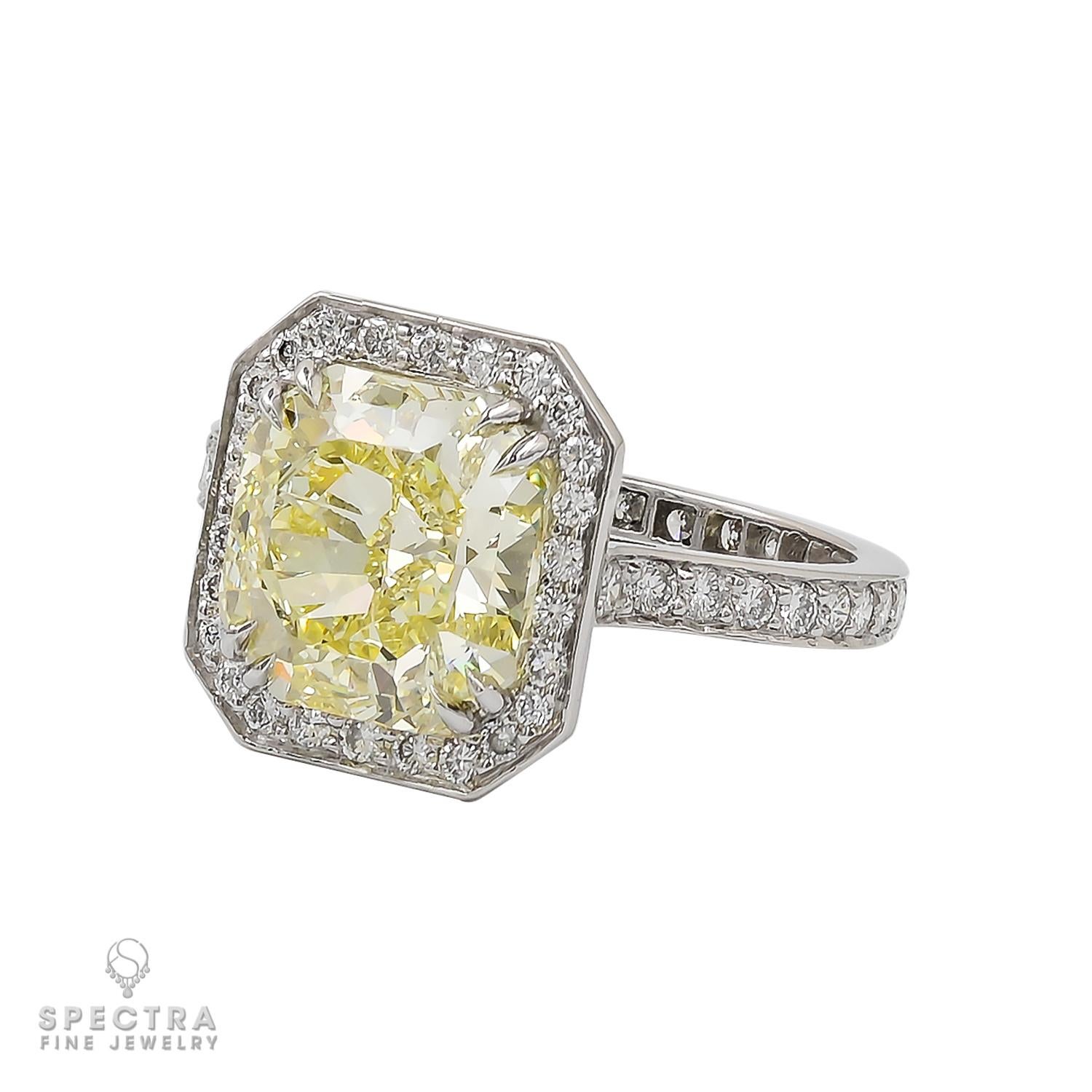 Embark on a journey of eternal love with our breathtaking engagement ring, graced by a magnificent 4.05-carat Fancy Yellow Diamond. This radiant-cut gem, boasting VVS2 clarity and GIA certification, is a luminous testament to the extraordinary.

A