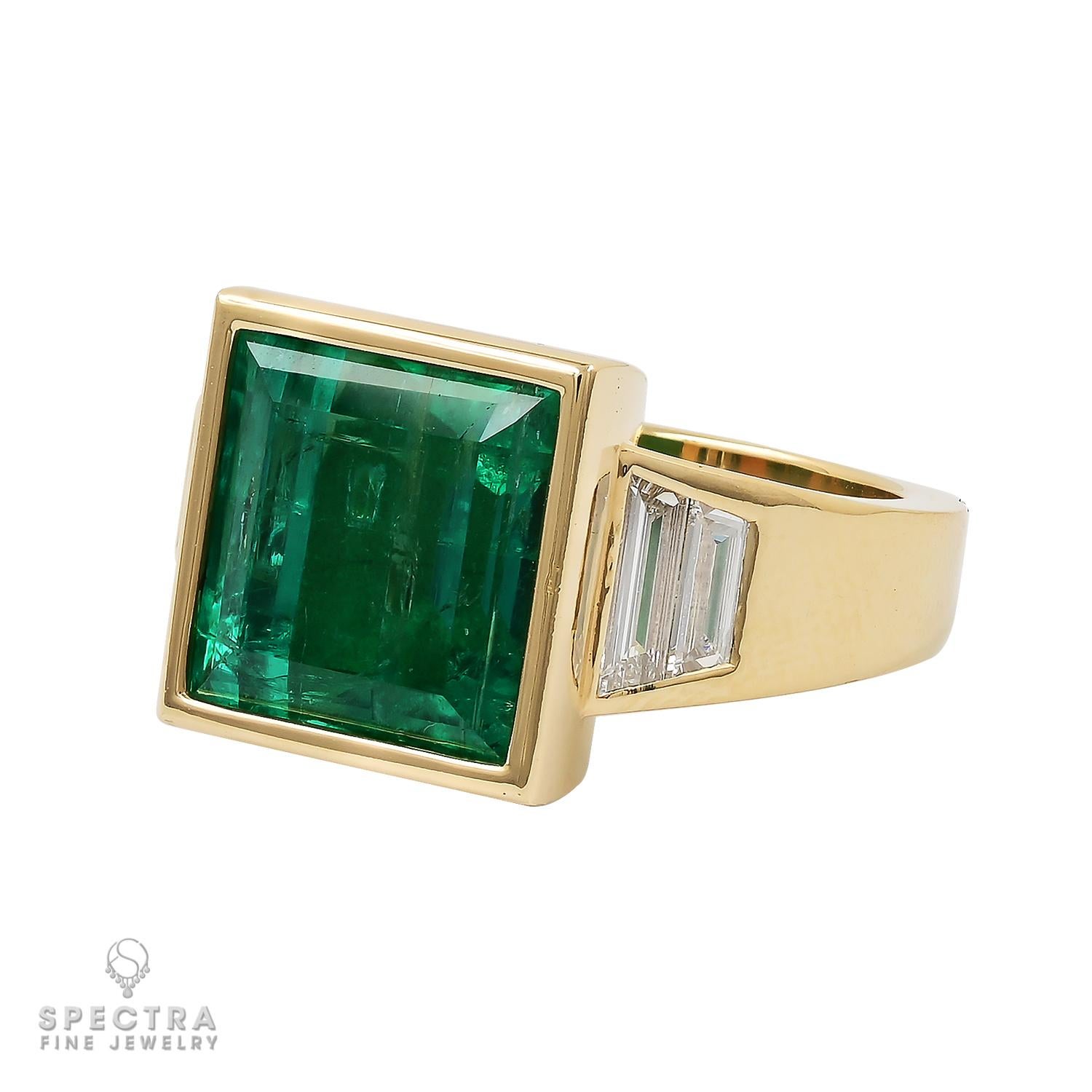 Step into the captivating world of this Contemporary Colombian Emerald Cocktail Ring made by Spectra Fine Jewelry. 

At the heart of this enchanting creation lies a 6.77 carat emerald-cut Colombian emerald, a gem of unrivaled prestige. Certified by
