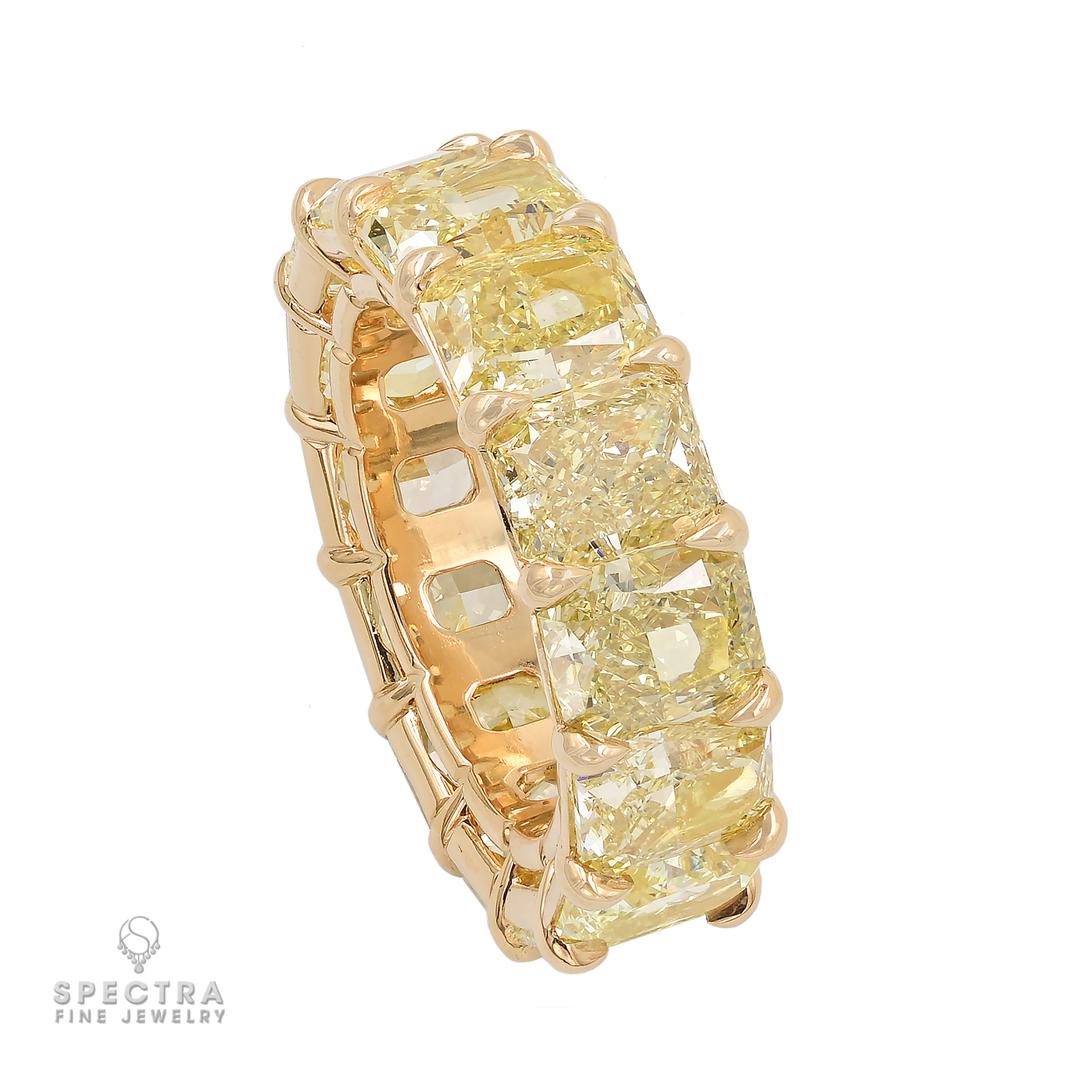 Behold the dazzling spectacle of the 15.13-carat Fancy Yellow Diamond Wedding Band by Spectra Fine Jewelry - an absolute knockout of charisma and charm! This ring is not just a piece of jewelry; it's a vibrant celebration of 14 fabulous fancy yellow