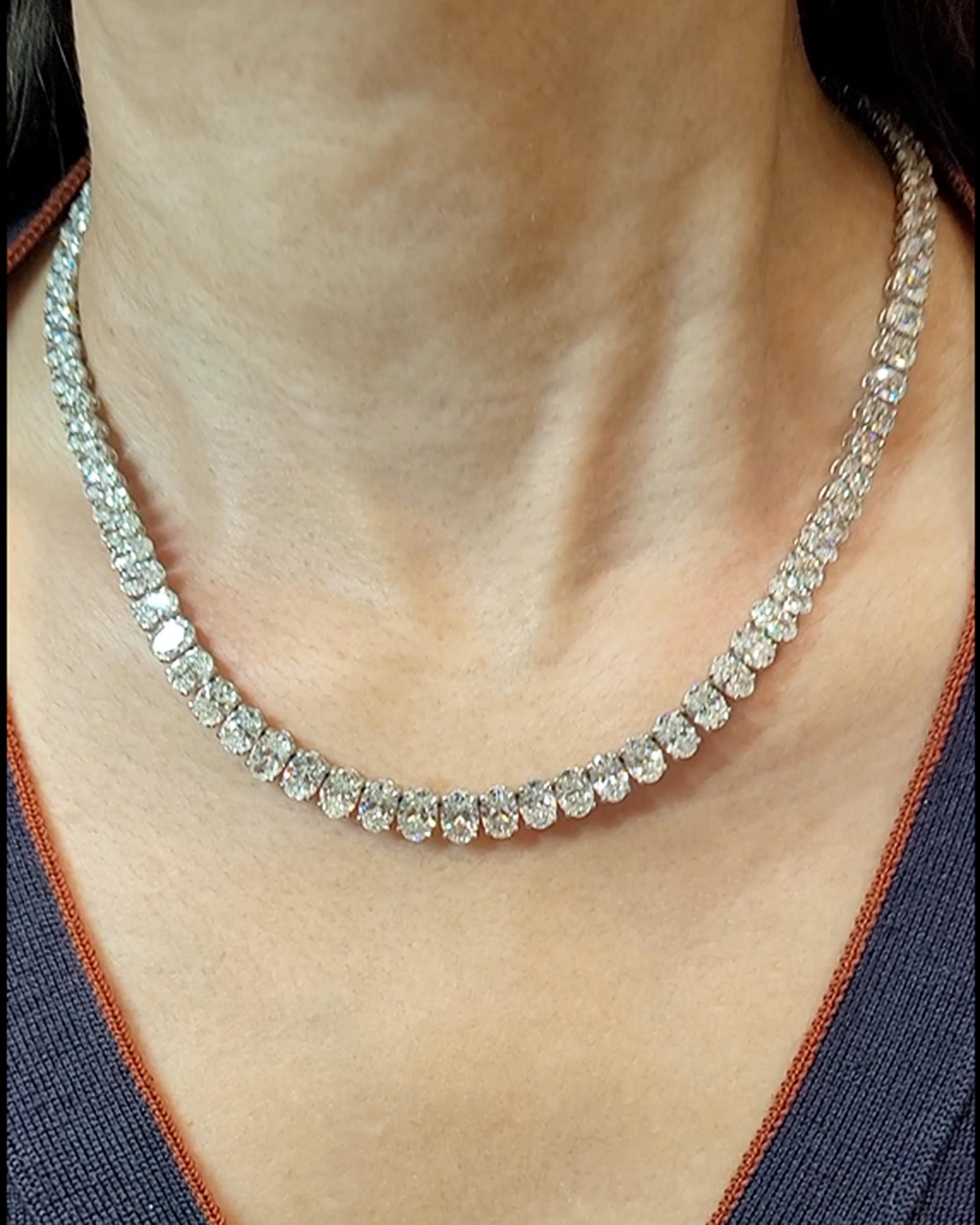 This exquisite Riviera Necklace consists of 92 oval-cut diamonds, with a combined weight of 40.65 carats. Notably, 75 of these diamonds have received GIA certification, affirming their exceptional quality with color grades ranging from D to G and