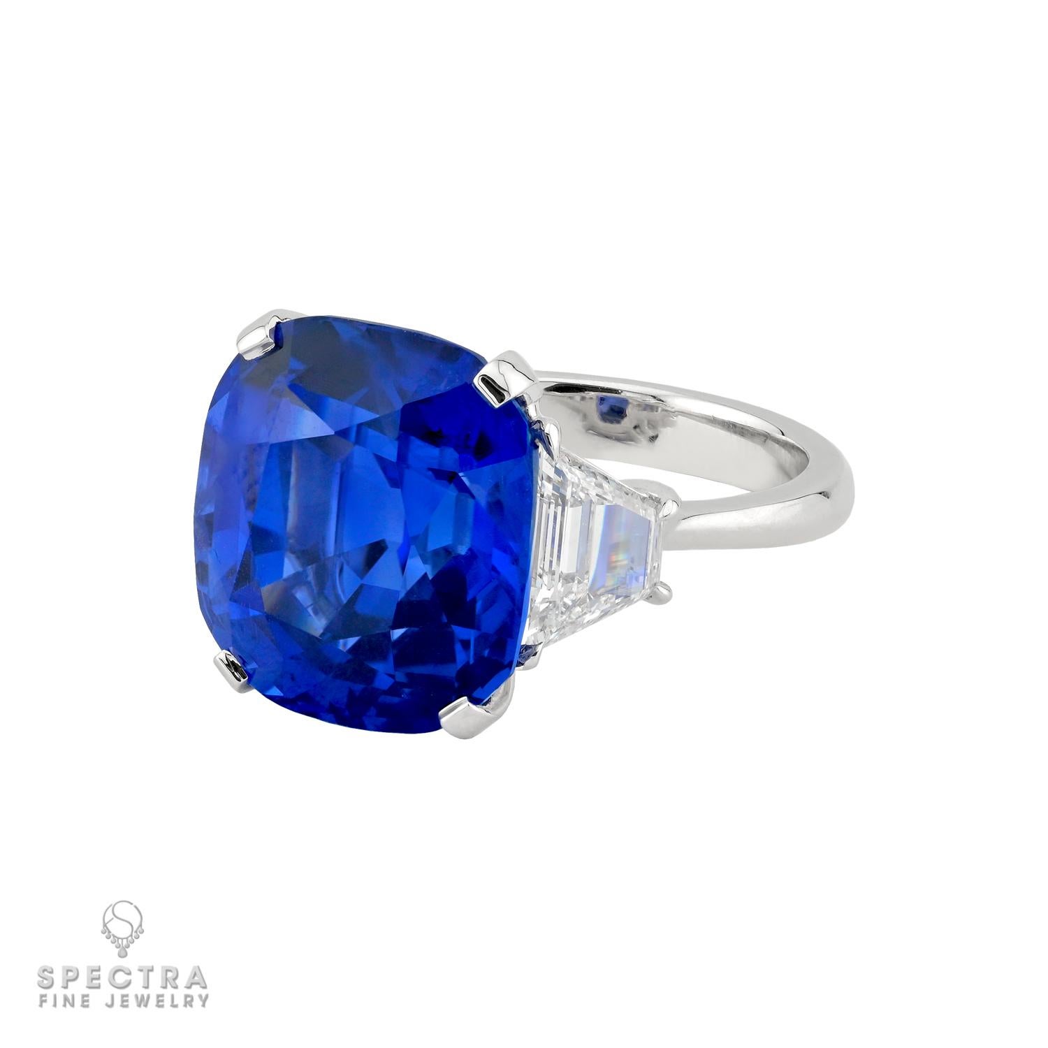 Commanding in beauty and refined in character, this exceptional ring centers a magnificent 14.80 carat cushion shaped Ceylon Royal Blue sapphire celebrated for its unheated origin and captivating depth of color. Accompanied by both GRS and AGL