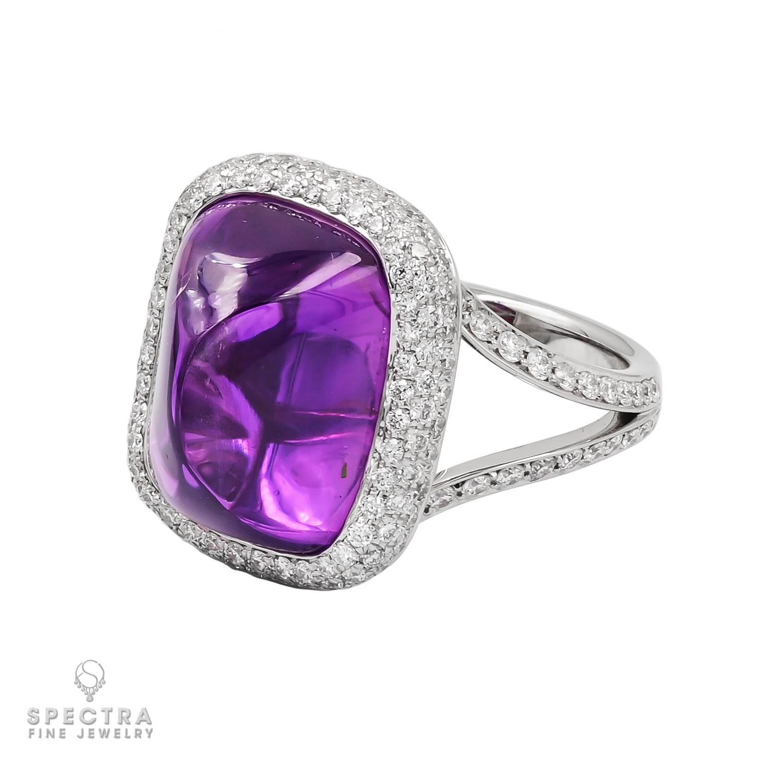Introducing the epitome of regal elegance, behold the breathtaking 15.83-carat Sugarloaf Cabochon Purple Sapphire Diamond Ring, meticulously crafted by Spectra Fine Jewelry in 2022. This magnificent piece features a mesmerizing purple sapphire of