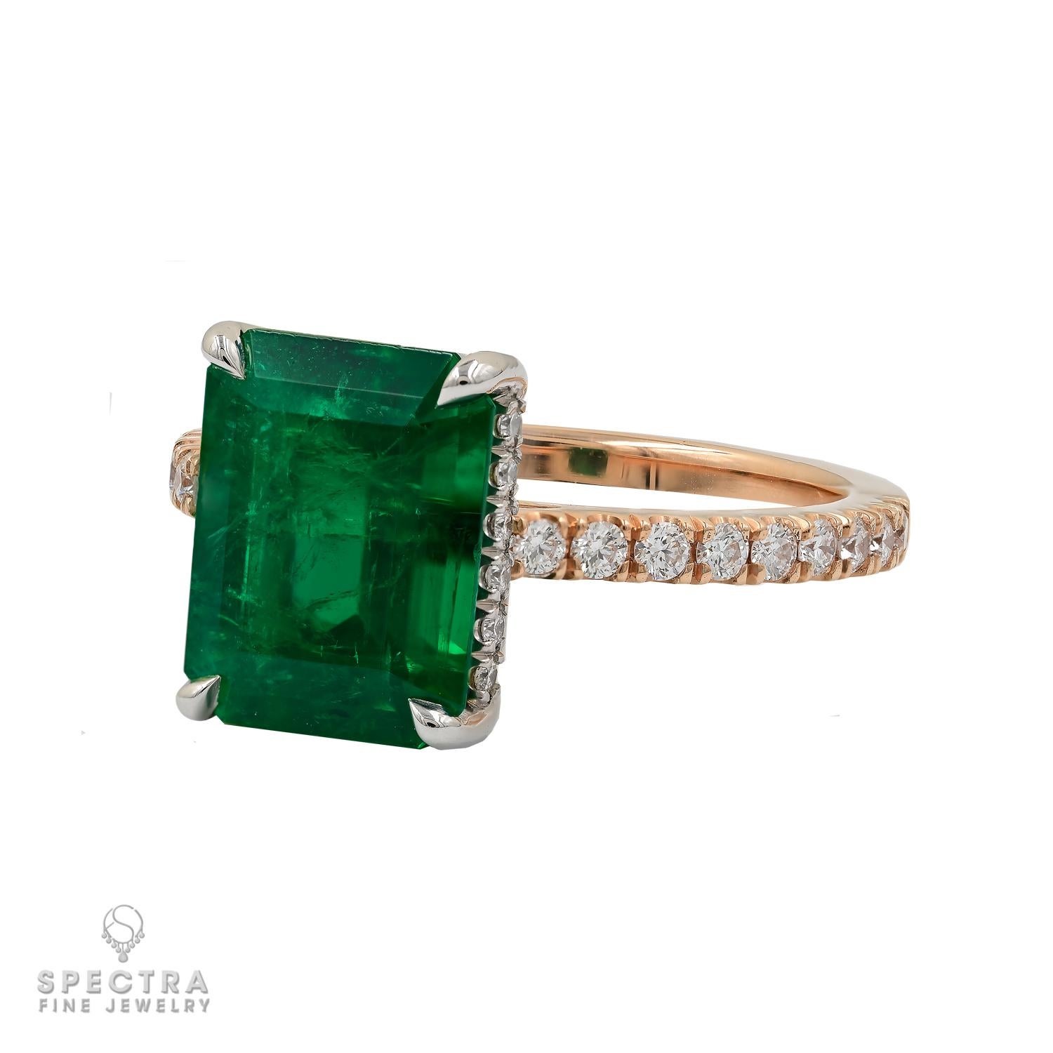 Presenting the Himalayan Emerald Diamond Ring, a breathtaking piece that transcends occasions, perfect as both a cocktail and engagement ring. 
At its heart lies a captivating 3.22-carat emerald-cut Himalayan Emerald, certified by GRS to be of