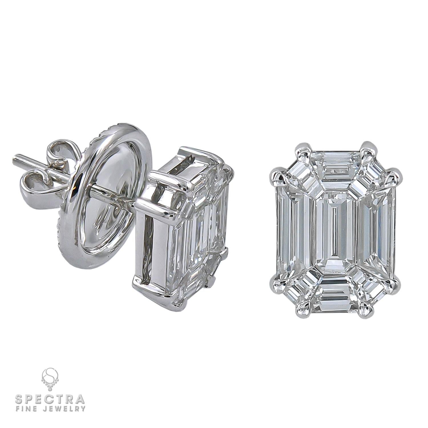 Beautiful stud earrings decorated with invisibly set diamonds. 
One earring is comprising of 9 pie-cut diamonds weighing a total of 1.08 carats.
The other earring is set with 9 pie-cut diamonds weighing a total of 1.09 carats.
Each earring has a