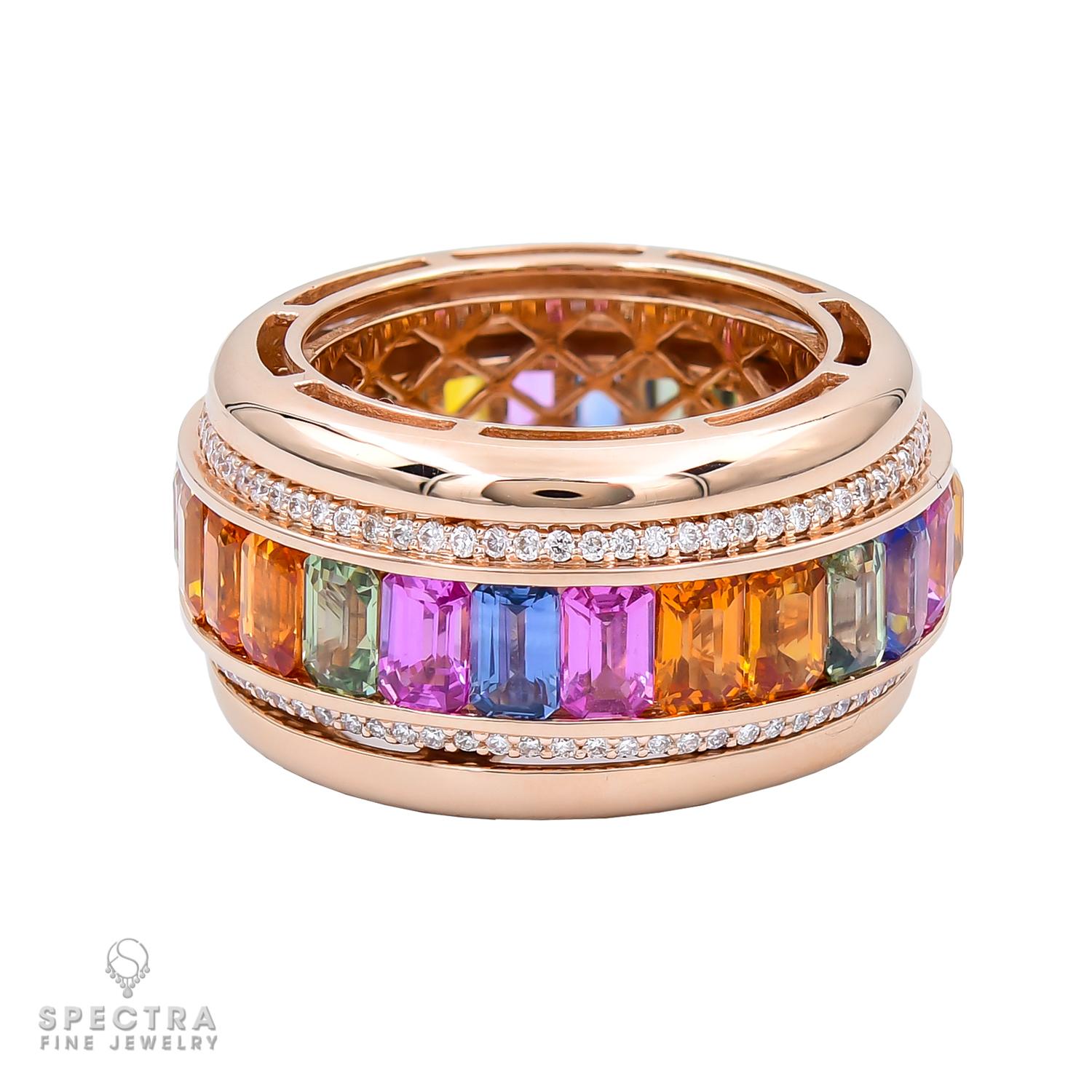A wide band ring featuring a spinning center set with 26 emerald-cut multicolored sapphires, weighing a total of 8.9 carats.
21 multicolored sapphires weighing a total of 7.16 carats.
5 pink sapphires weighing a total of 1.74 carats.
Each stone is