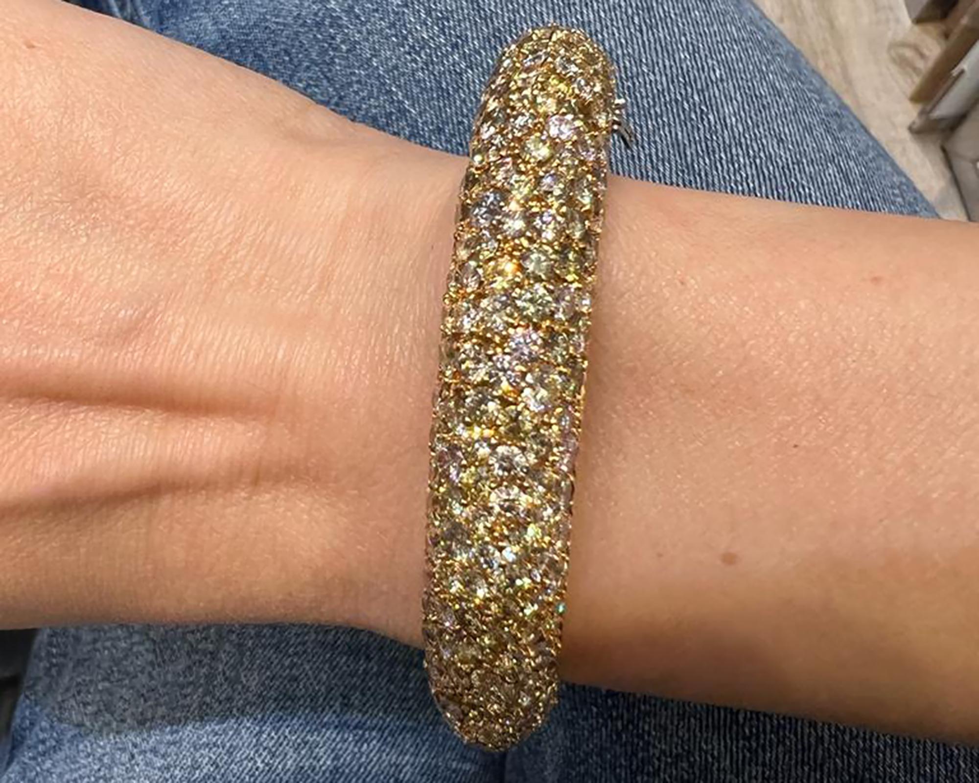Multicolored diamonds can have an ethereal quality that is extremely delicate and light in a way that is too perfect for this world. This Contemporary Multicolor Diamond Pavé Bombé Bangle Bracelet, made by Spectra Fine Jewelry in 2021, is crafted in
