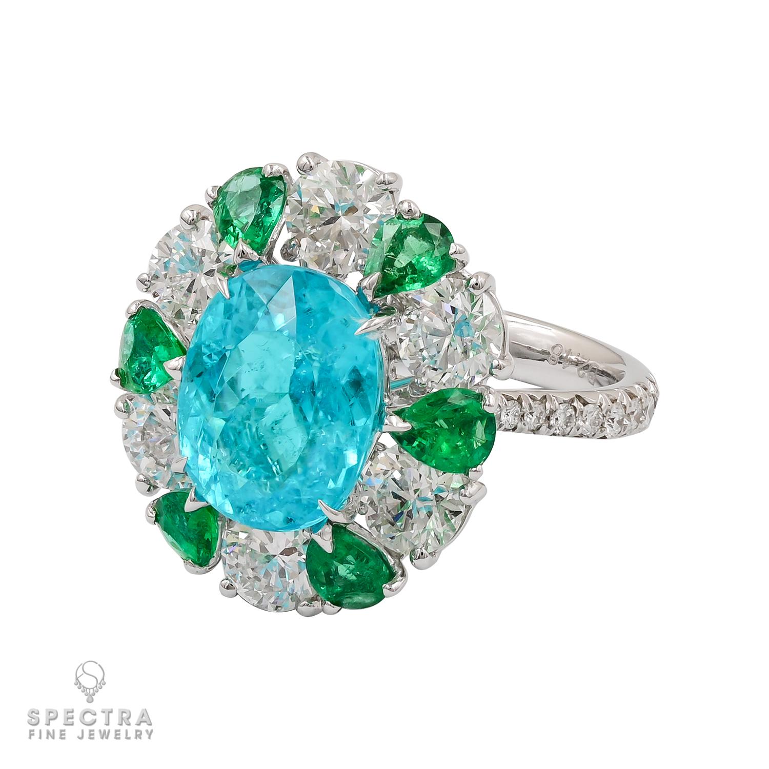 In 1989, exceptionally brightly colored tourmalines were discovered in the state of Paraíba, Brazil and presently are among the world’s most prized gemstones. These rare gems are renowned for showing intense blue colors.

This exquisite ring nestles