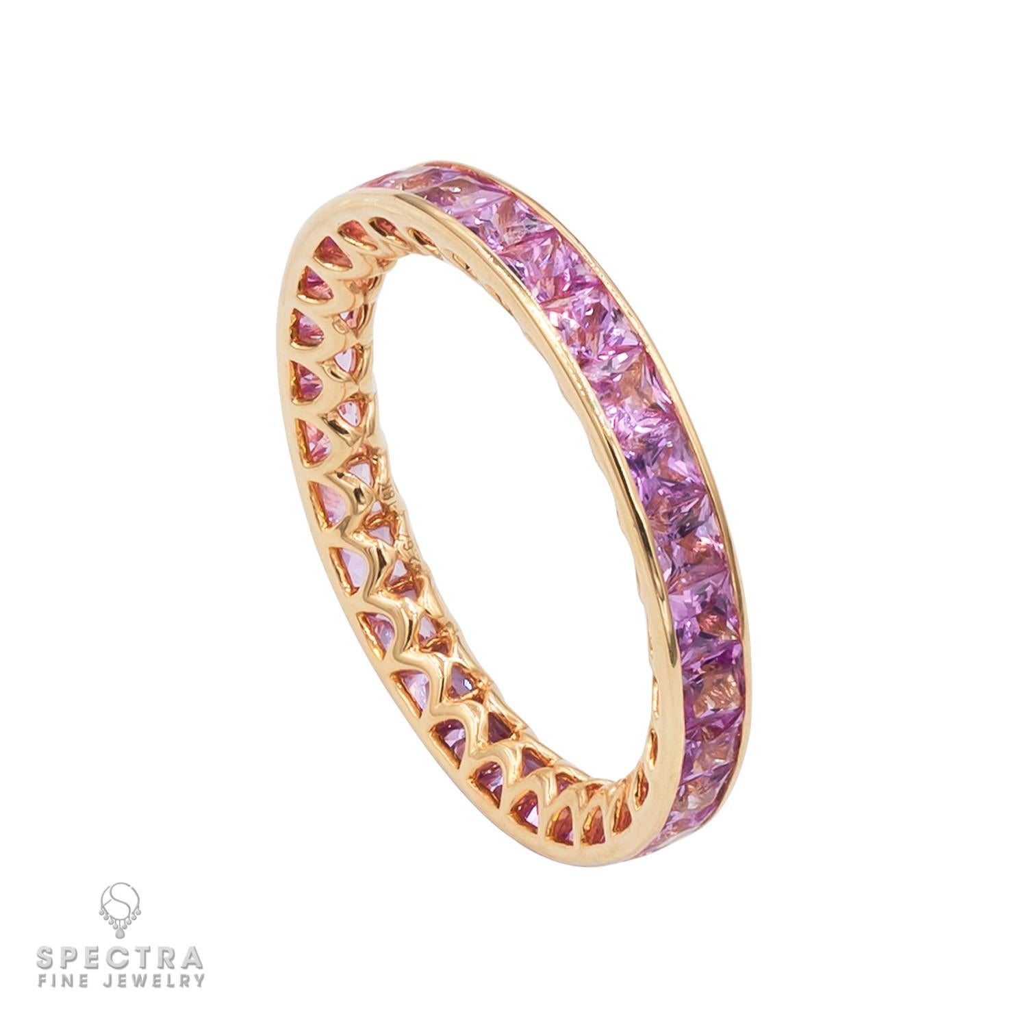 Pink sapphires are always spectacular for their captivating and unusual color. In this Pink Sapphire Eternity Band made by Spectra Fine Jewelry, the beautifully wrought openwork setting that peaks out from under the stones is just as stunning. From