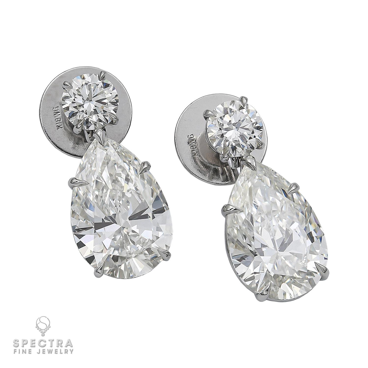 These exquisite earrings feature a pair of pear-shaped diamonds, renowned for their graceful and tapered silhouette, making them the perfect choice for stunning drop earrings that capture attention with every graceful sway. The enchanting