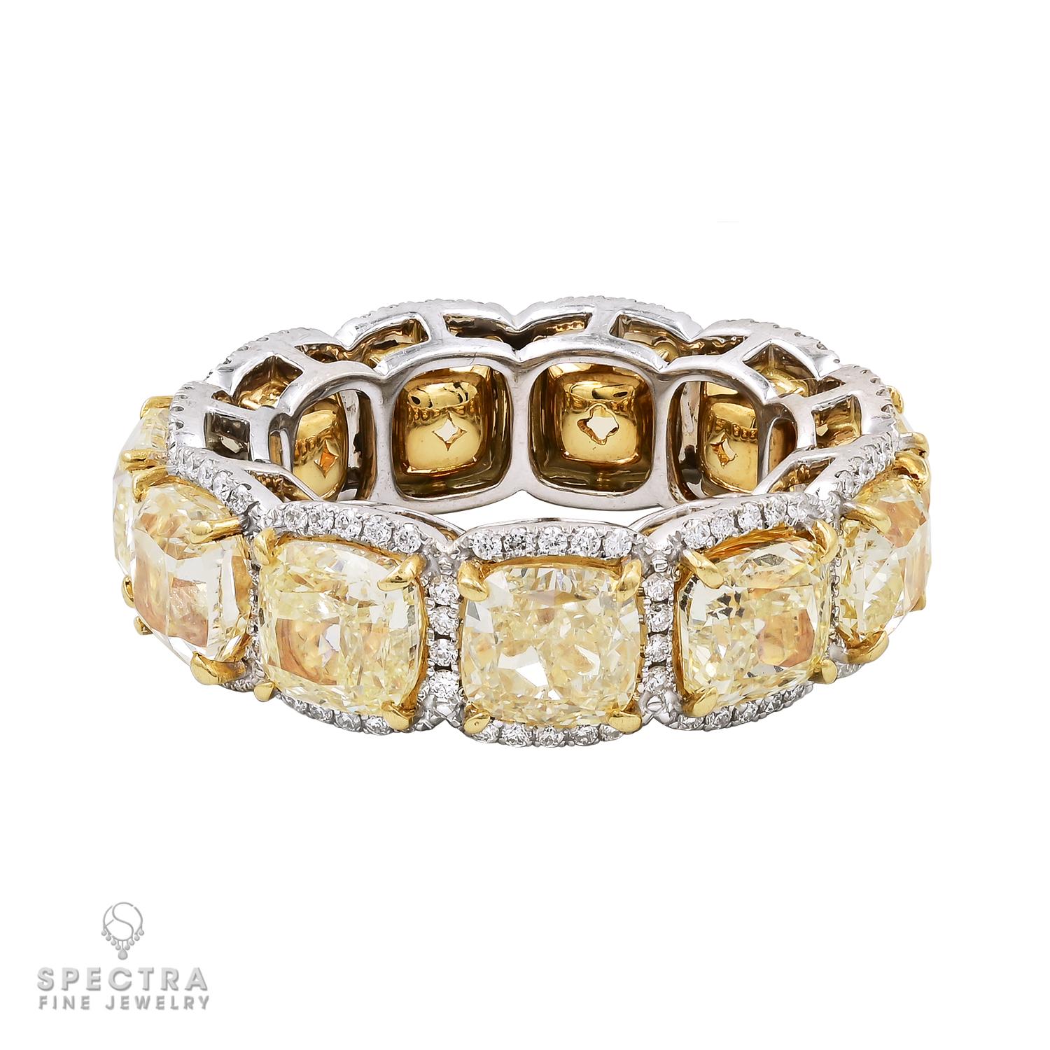 The 12.04cts Cushion Fancy Yellow Diamond Eternity Band ring by Spectra Fine Jewelry is an exquisite and captivating piece that exudes elegance and luxury. Crafted with meticulous attention to detail, this ring showcases 11 dazzling Fancy Yellow