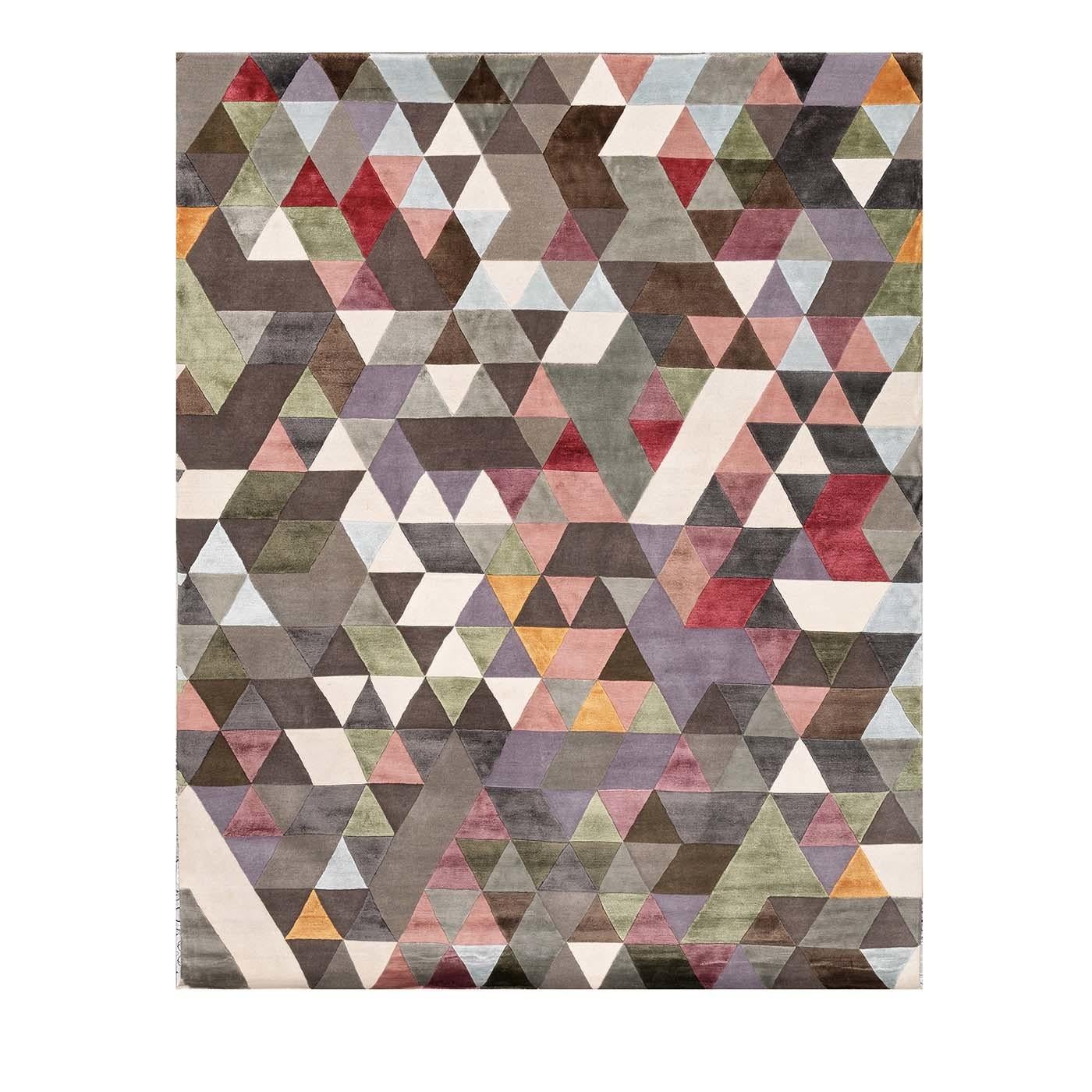 A series of multicolored triangles enlivens the surface of this exquisite rug, which will be an excellent choice for a contemporary interior, enlivening an entryway, living room, or bedroom. This playful and charming piece is hand knotted in Nepal