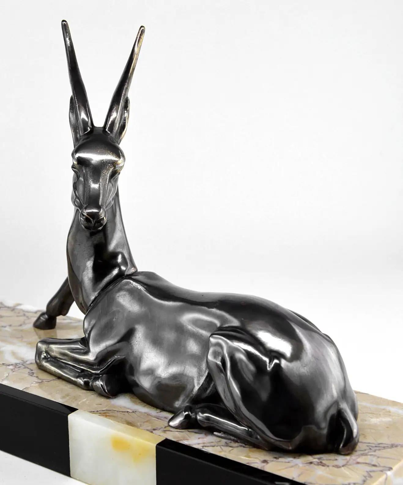 Antelope sculpture, France, 1930s. Spelter, marble and onyx. Measures: width 17.7