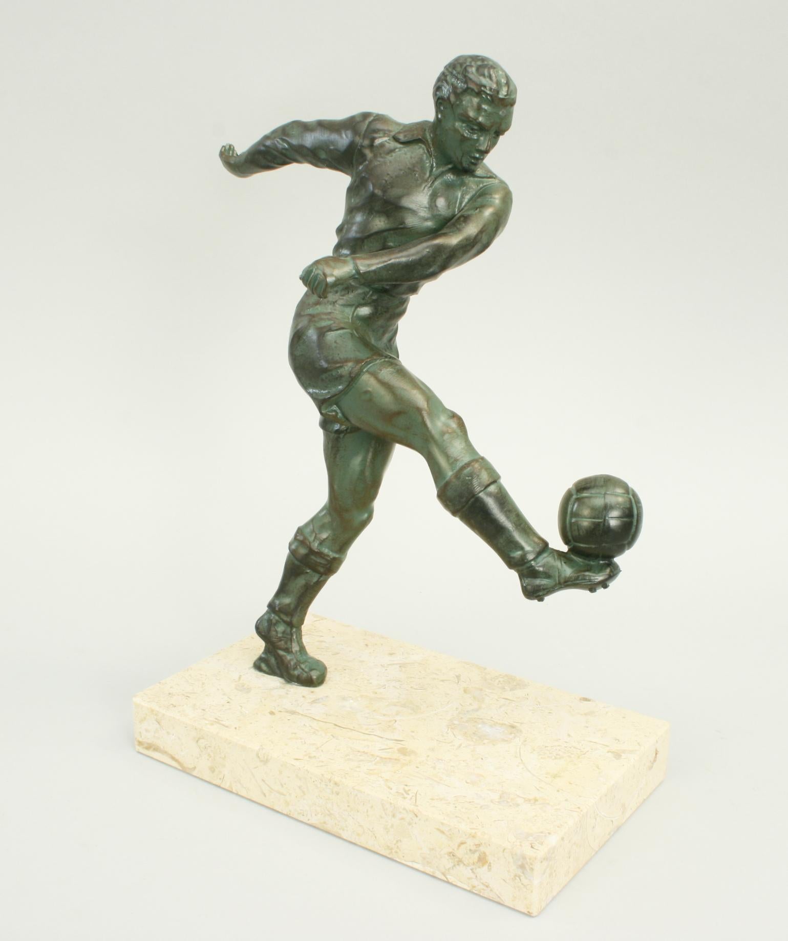 Vintage Bronzed Spelter Football Figure.
A very nice French Art Deco style spelter figure of a footballer. The footballer is kicking a football with his right foot and has a verdigris finish to look like weathered bronze. The figure is mounted on a