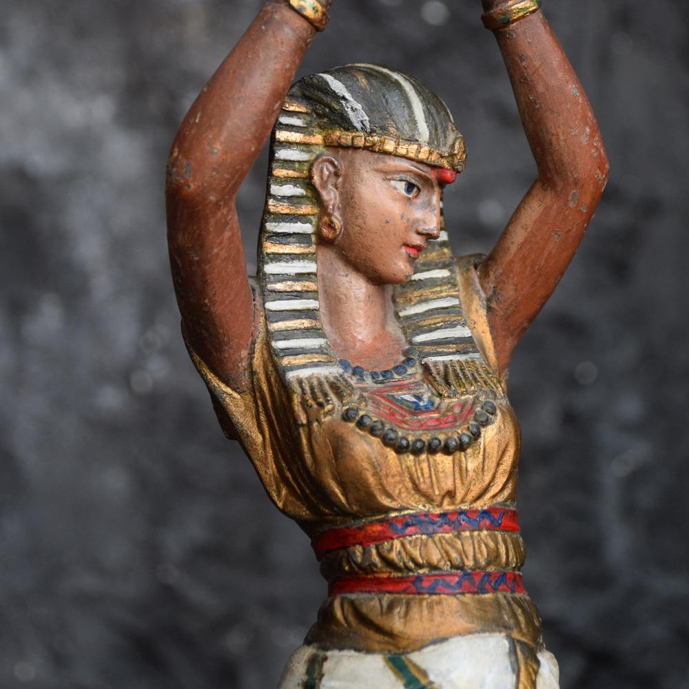 Spelter hand painted candlestick Egyptian figure, circa 1900
We are proud to offer a late 19th century spelter candlestick figure, depicting an Egyptian woman holding a vase. Hand painted with much attention to detail and elegant in form. Recently